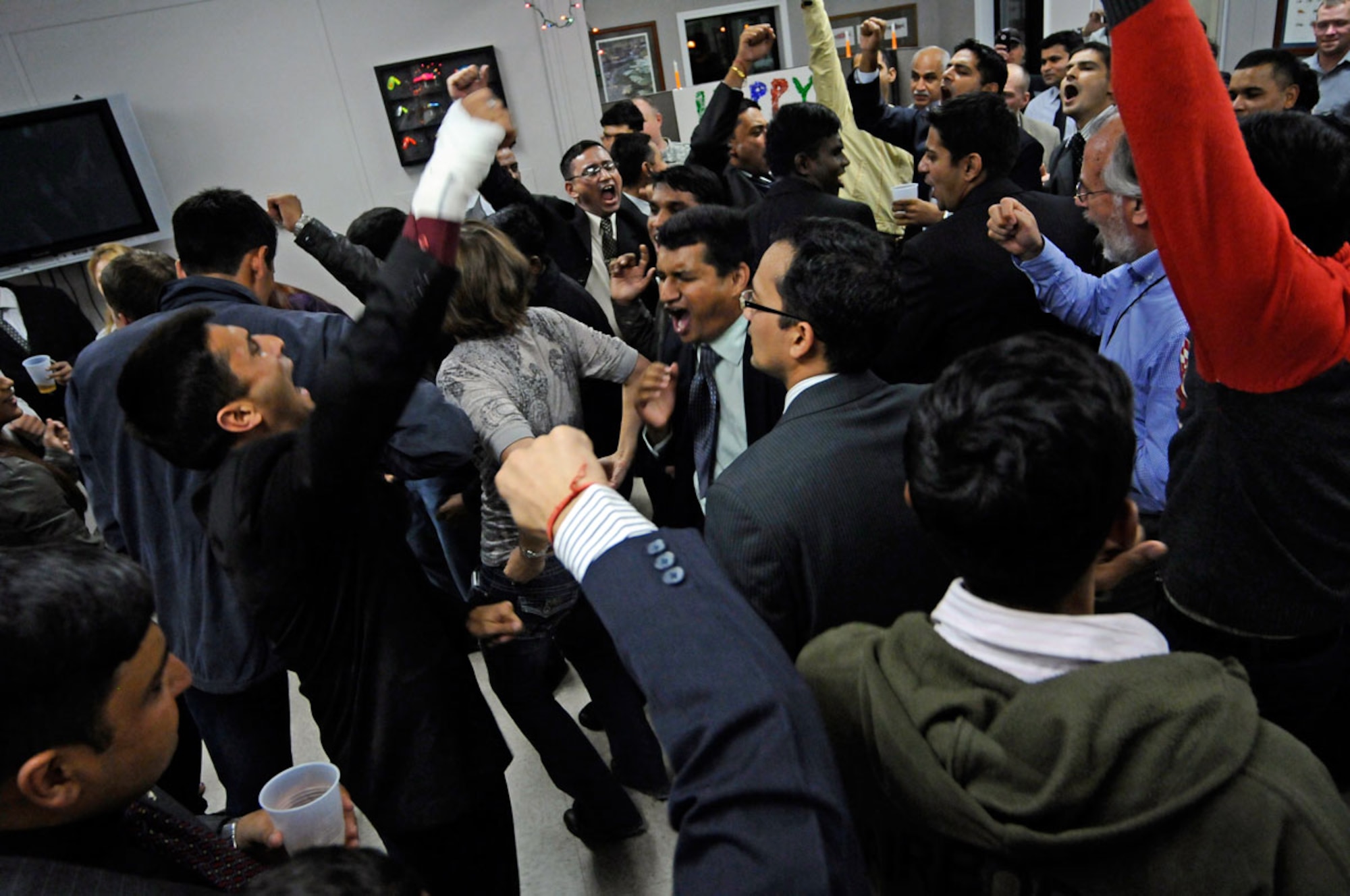 Joint Base Elmendorf-Richardson, Alaska - U.S. and Indian Soldiers and civilians dance to a variety of American and Indian hip-hop music, and sample the many special Indian sweets in celebration of Diwali at the Wilderness Inn Dining Facility.  Perhaps the most well-known of the Indian festivals, Diwali is celebrated throughout India and is known as the "festival of lights".   (U.S. Air Force photo/Percy G. Jones)
