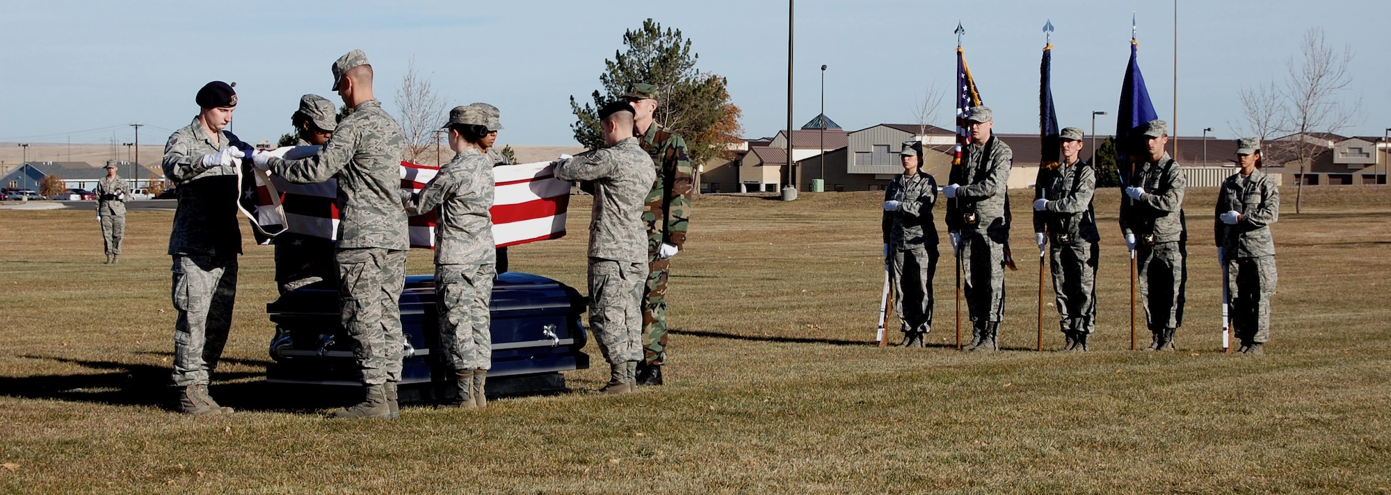 Twenty one of the newest ceremonial guardsmen from Malmstrom and the Montana Air National Guard conduct a full honors funeral demonstration Nov. 5 at Medal of Honor Park. The demonstration was conducted in conjunction with the annual class graduation. This was the first year National Guard members attended the training at Malmstrom. (U.S. Air Force photo/Staff Sgt. Dillon White)