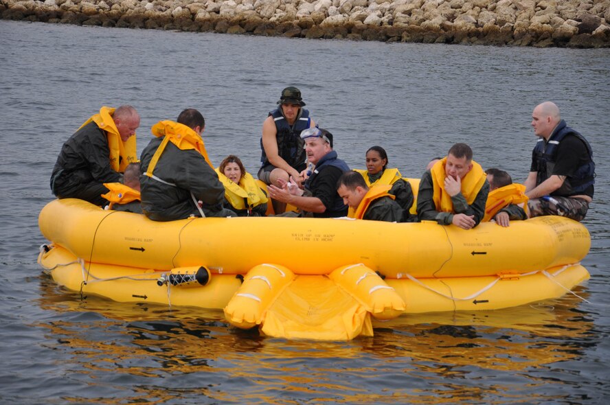 WRIGHT-PATTERSON AIR FORCE BASE, Ohio – Tech. Sgt. Paul Bower, 445th Operational Support Squadron, explains survival techniques to Airmen from the 445th Aeromedical Evacuation Squadron and the 89th Airlift Squadron. More than 75 reservists from the 445th Airlift Wing took part in semi-annual water survival training requirements at the Naval Air Station in Key West, Fla., Oct. 13-16. (U.S. Air Force photo/Staff Sgt. Robert Nelson)