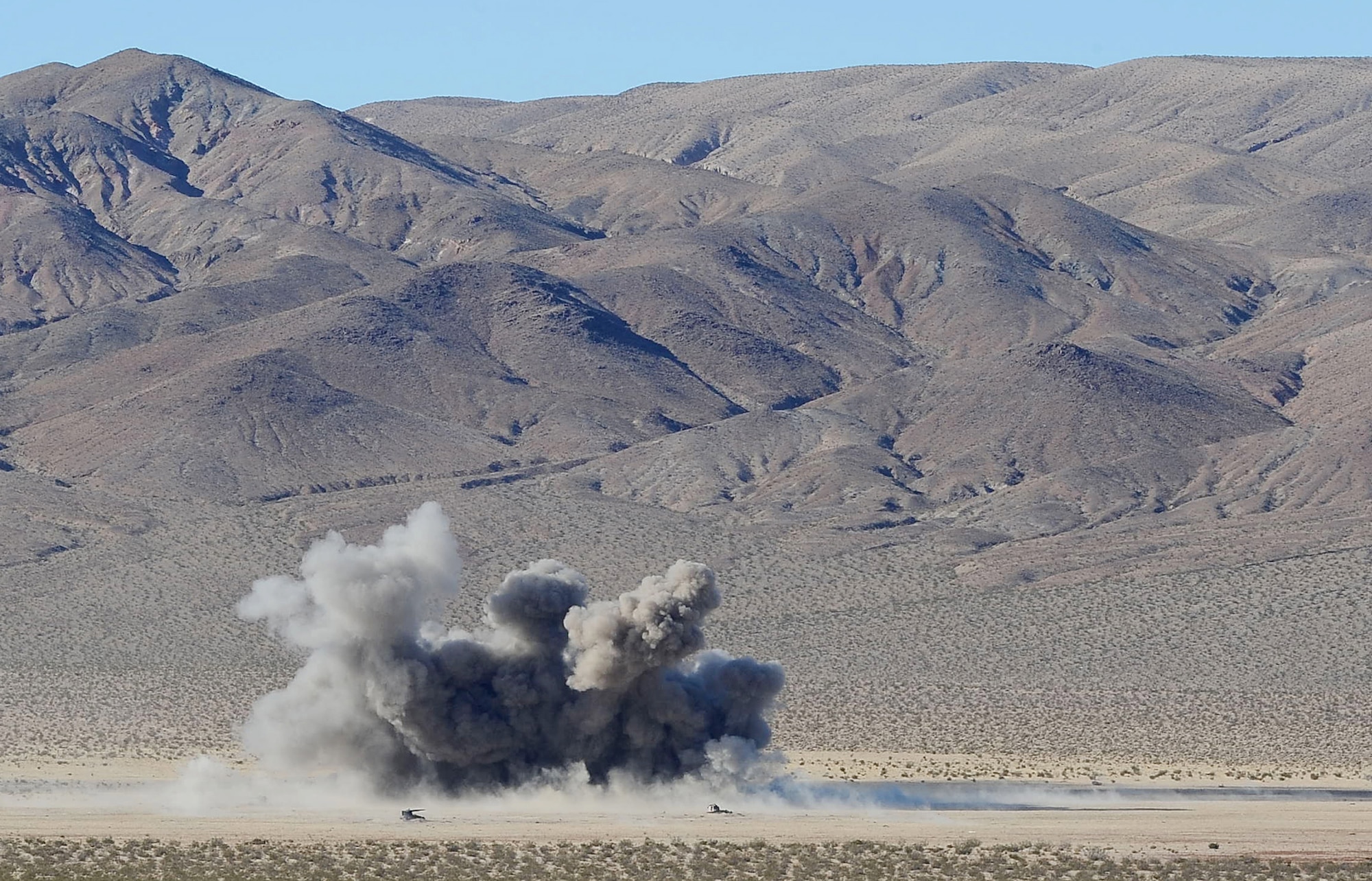 At the direction of the 12th Combat Training Squadron Airmen, an F-15 Eagle drops live ordnance Nov. 1, 2010, at the training range on Fort Irwin, Calif. (U.S Air Force photo/Senior Airman Stephanie Rubi)