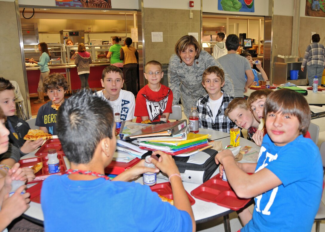 Maj. Andrea Pitruzzella of the 914th Airlift Wing chats with students of the Edward Town Middle School during their lunch period, November 12, 2010, Wheatfield, NY. During an annual lunch held in recognition of military members students had the opportunity to learn from the experiences of military members. (U.S. Air Force photo by Staff Sgt. Joseph McKee)