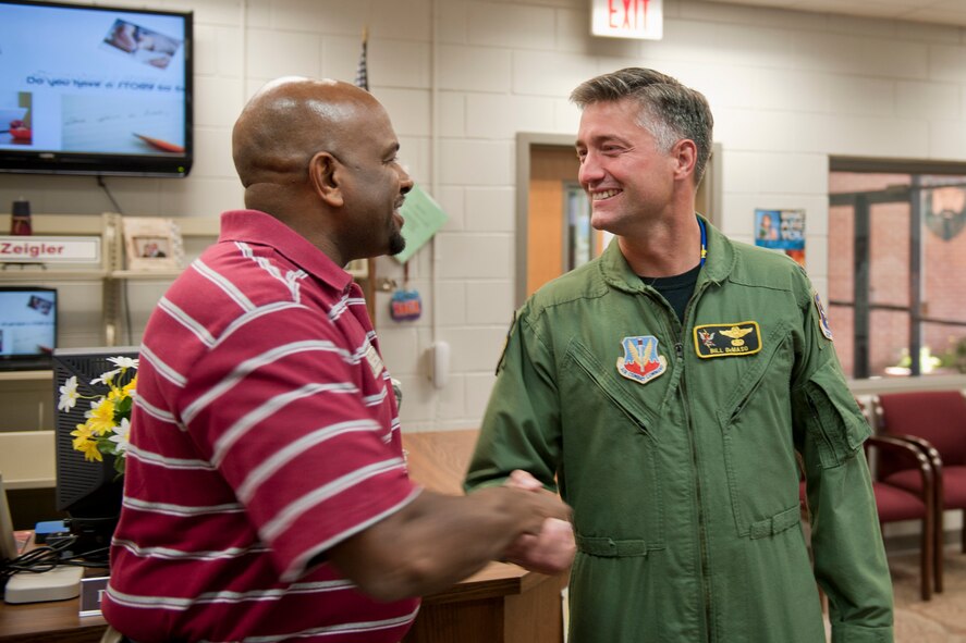 VALDOSTA, Ga. -- Derald Jones, Lowndes Middle School principal, greets Col. William DeMaso, 23rd Wing vice commander, during the colonel's visit to Lowndes Middle School Nov. 12. Colonel DeMaso thanked and recognized the children from the school who participated in the 2010 Air Show Logo Contest. (U.S. Air Force photo/Senior Airman Jamal D. Sutter)(RELEASED)