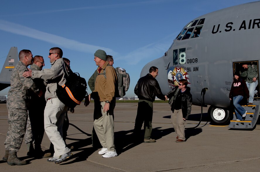 Members of the 32nd Aerial Port Squadron are welcomed home from a deployment to South East Asia, Nov. 12. The Airmen were deployed for approximately 90 days. (U.S. Air Force photo/Senior Airman Joshua J. Seybert)
