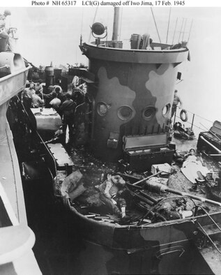 "Death on the Deck of an LCI....Iwo Jima --- Americans died at their gun posts as enemy fire crashed aboard this LCI while assault boats headed in to the landing beaches on Iwo Jima. In the picture, the dead and injured gun crewmen still lie on the deck as another ship puts alongside to give aid. Groups (of) troops are still engaged in bitter and costly fighting on the tiny Jap island." Quoted from the original picture caption released for publication on 26 February 1945 by Commander in Chief, Pacific. (This image shows one of several Landing Craft Infantry (Gunboat)s [LCI(G)] that were badly shot up by Japanese defenses on 17 February 1945, while supporting Underwater Demolition Teams off Iwo Jima. Note the 40mm single gun in the foreground, shell fragment damage to the ship's conning tower, and her pattern camouflage.)

The original photograph came from the illustrations package for Rear Admiral Samuel Eliot Morison's "History of United States Naval Operations in World War II", volume XIV: "Victory in the Pacific".

Official U.S. Navy Photograph, from the collections of the Naval Historical Center.
