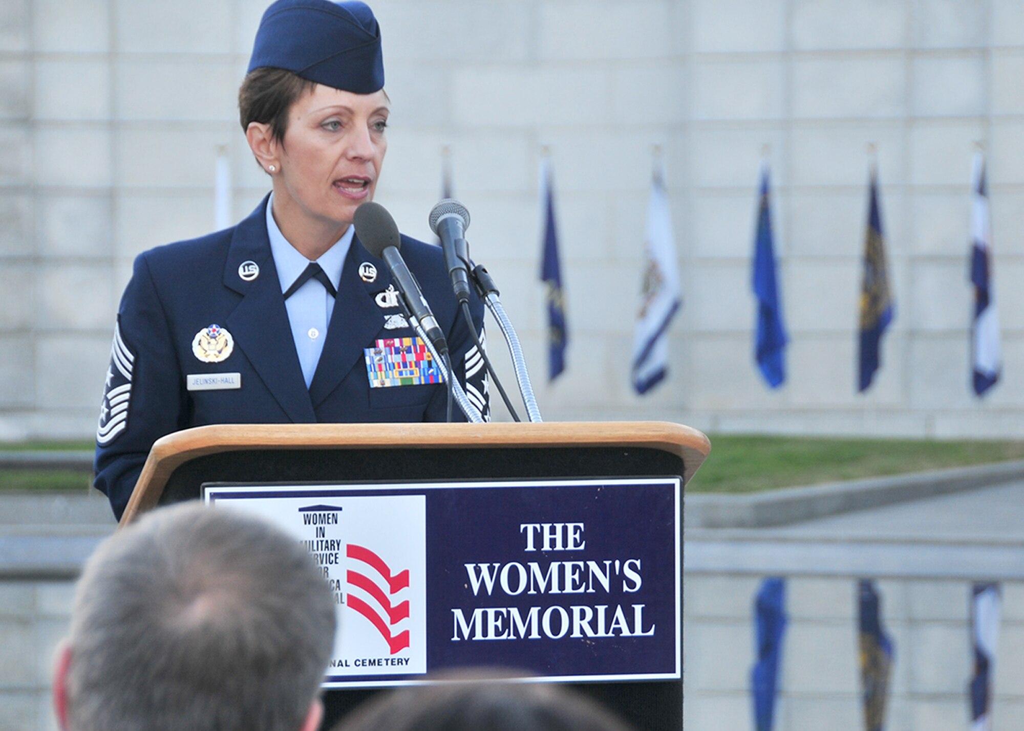 Chief Master Sgt. Denise Jelinski-Hall celebrates the history of the American fighting woman during her Veterans Day speech Nov. 11, 2010, at the Women in Military Service for America Memorial at Arlington National Cemetery in Arlington, Va.  Chief Jelinski-Hall is the National Guard senior enlisted advisor.  (U.S. Air Force photo/Tech. Sgt. Leisa Grant)
