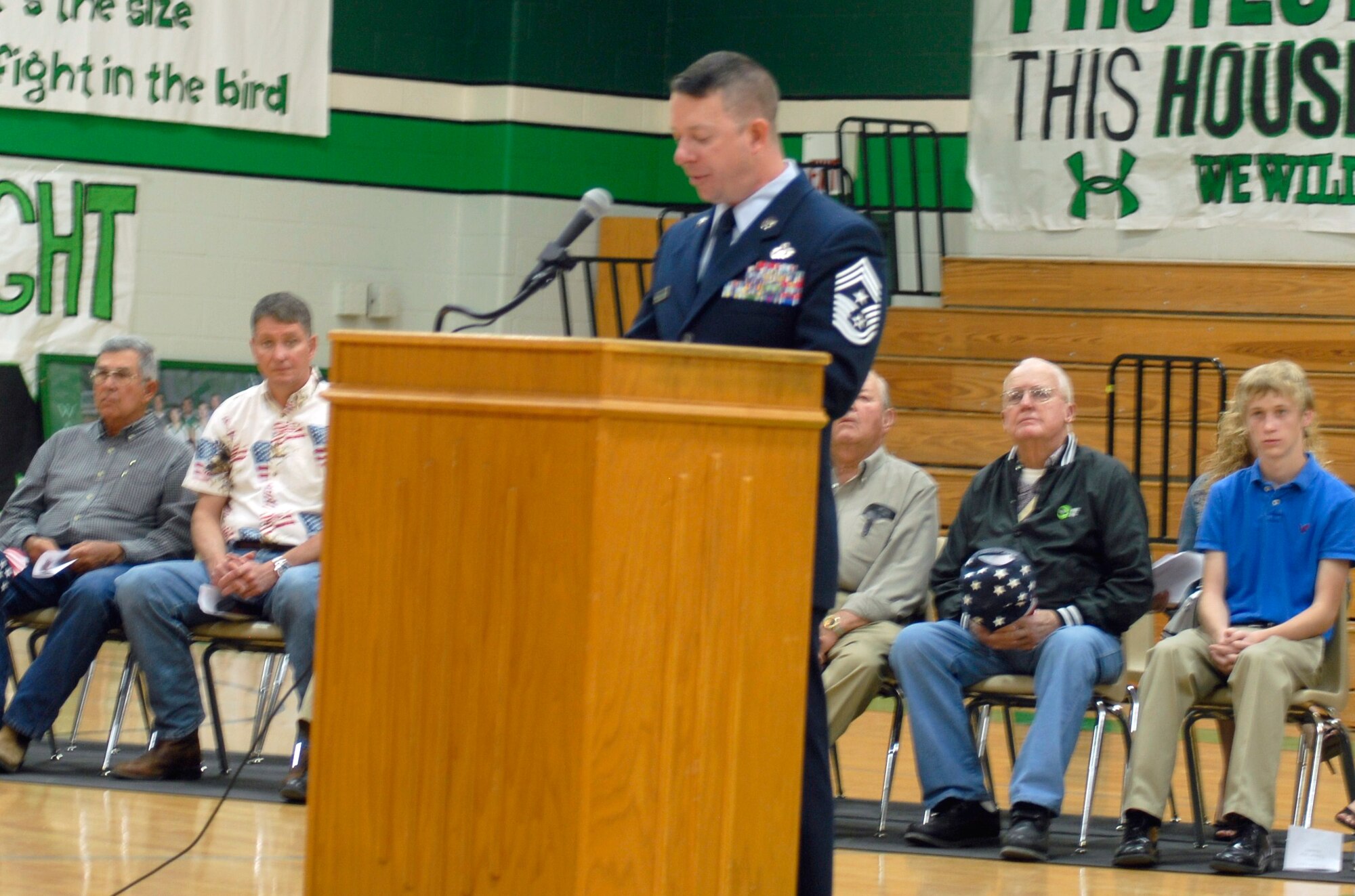 GOODFELLOW AIR FORCE BASE. Texas - Chief Master Sgt. Brendan Criswell, 17th Training Wing Command Chief, speaks to veterans, students, teachers and community members during the Wall High School Veteran's Day assembly held Nov. 11. The school holds the assembly to recognize and show appreciation to the men and women who fought for our freedoms. (U.S. Air Force photo/Airman 1st Class Anne Gathua)