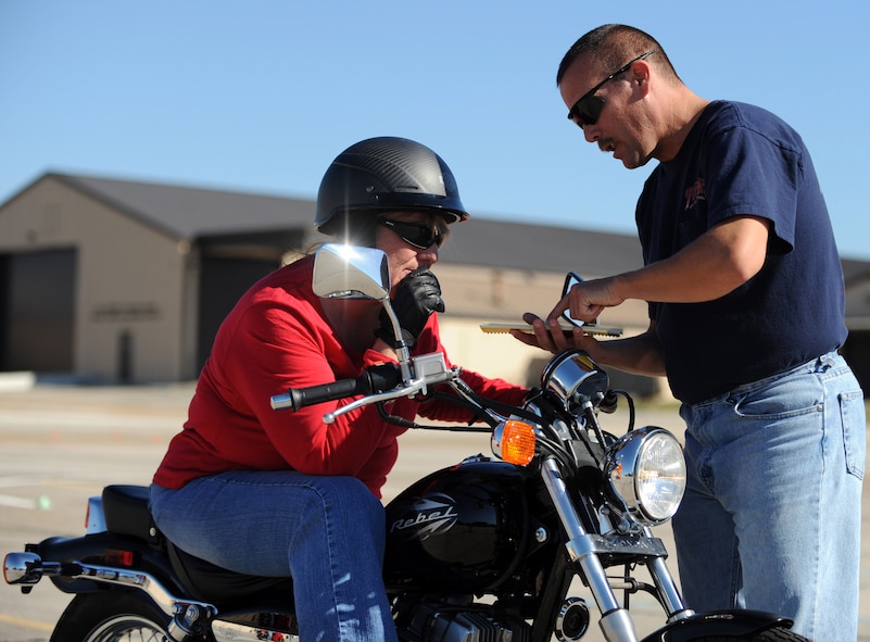 MOODY AIR FORCE BASE, Ga. -- Cliff Sowder, motorcycle safety course instructor, shows a student proper turning procedures Nov. 10. Mr. Sowder demonstrated how to properly shift weight when making a turn. (U.S. Air Force photo/Airman 1st Class Douglas Ellis)(RELEASED)