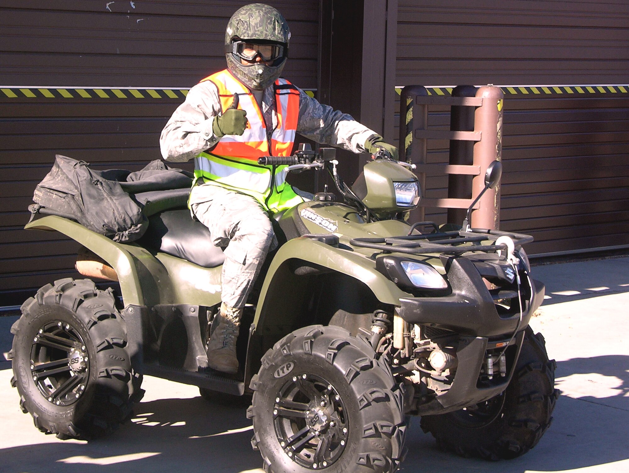 ELLSWORTH AIR FORCE BASE, S.D. - Col. Trent Edwards, 28th Mission Support Group commander, signals he's ready to head out with 28th Security Forces Squadron Airmen on all-terrain vehicles, Nov. 5. The team of Airmen and commanders drove around the perimeter of the base to ensure its integrity. (Courtesy photo/Master Sgt. Scott Vesperman)