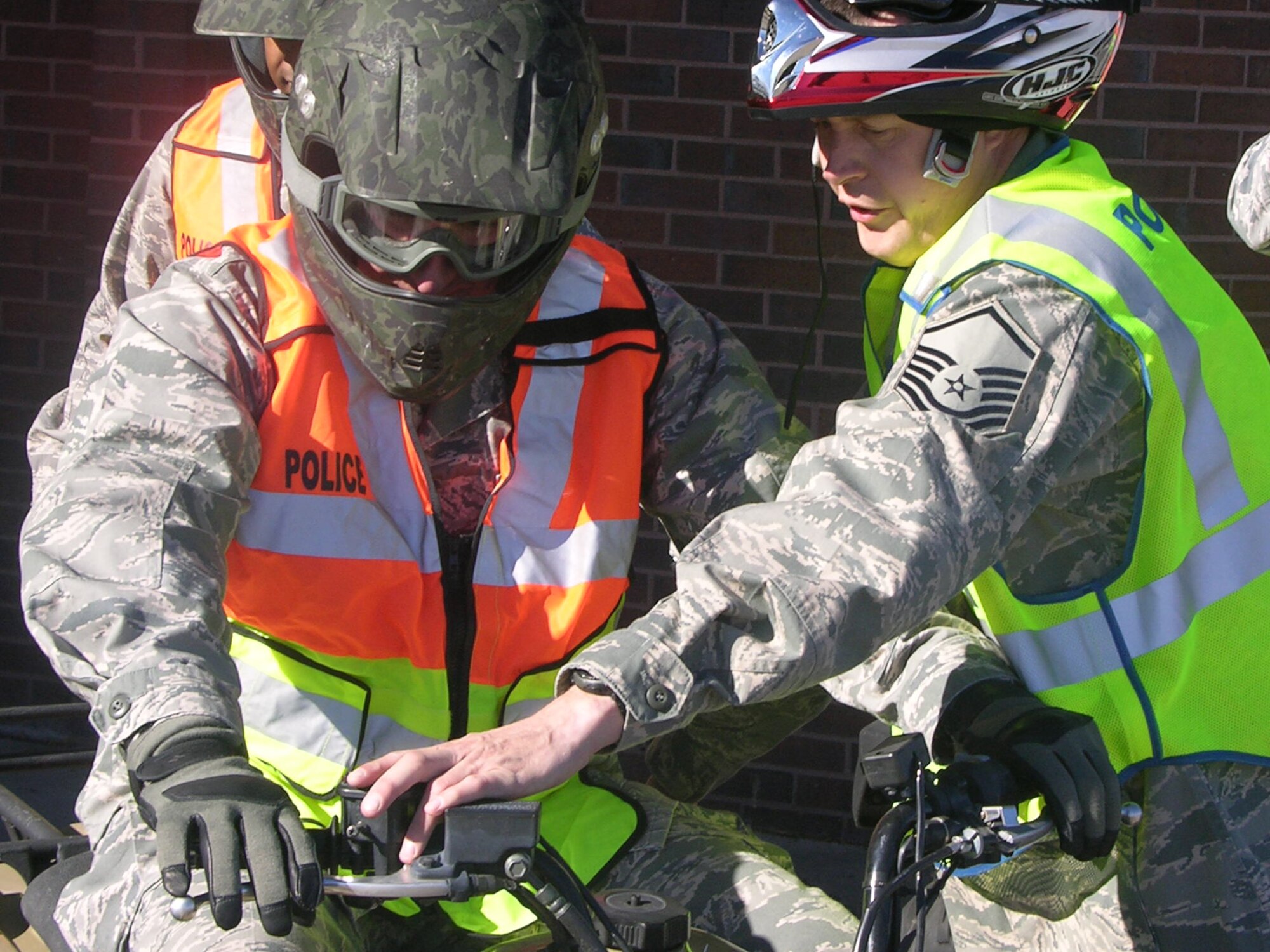 ELLSWORTH AIR FORCE BASE, S.D. - Master Sgt. Scott Vesperman, 28th Security Forces Squadron intelligence section chief, gives Col. Jeffrey Taliaferro, 28th Bomb Wing commander, a safety brief on the safe and responsible operation of an all-terrain vehicle he will use to check the base perimeter, Nov. 5. Colonel Taliaferro, along with other commanders from the base, checked the perimeter with security forces Airmen, to ensure its integrity.  (Courtesy photo /Master Sgt. Carlos Moore)