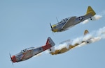 The AeroShell Aerobatic Team flies during AirFest 2010 Nov. 6. The team flew World War II aircraft through a series of precision formation aerobatic maneuvers. (U.S. Air Force photo/Alan Boedeker)