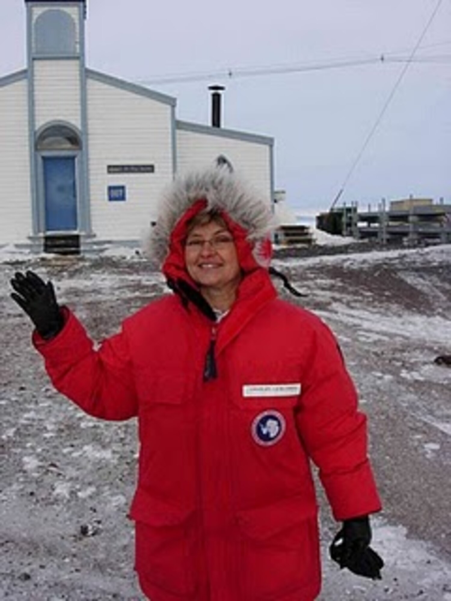U.S. Air Force Chaplain (Major) Laura Adelia poses in front of Chapel of the Snow, McMurdo Station, Antarctica, where she became the first female chaplain on station during her 60-day tour Oct. 3, 2010. She will be providing spiritual support to the various military personnel assigned to “Operation Deep Freeze,”  (courtesy photo)