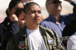 George Alvarado Jr. watches the Lackland AirFest 2010 rehearsal during the honored guests show Nov. 5. (U.S. Air Force photo/Robbin Cresswell)