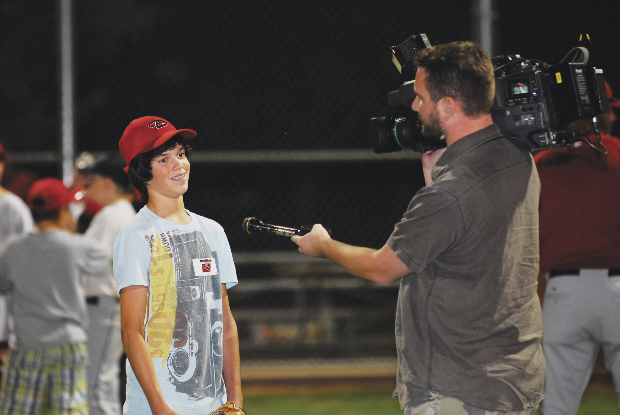 Brendan McKelvy, 13, is interviewed by Fox 10 Phoenix on Nov. 5 during the Arizona Diamondbacks free baseball clinic at Mark Grace Thunderbolt Field at Luke Air Force Base, Ariz.  (U.S. Air Force photo/Austin Thomas)