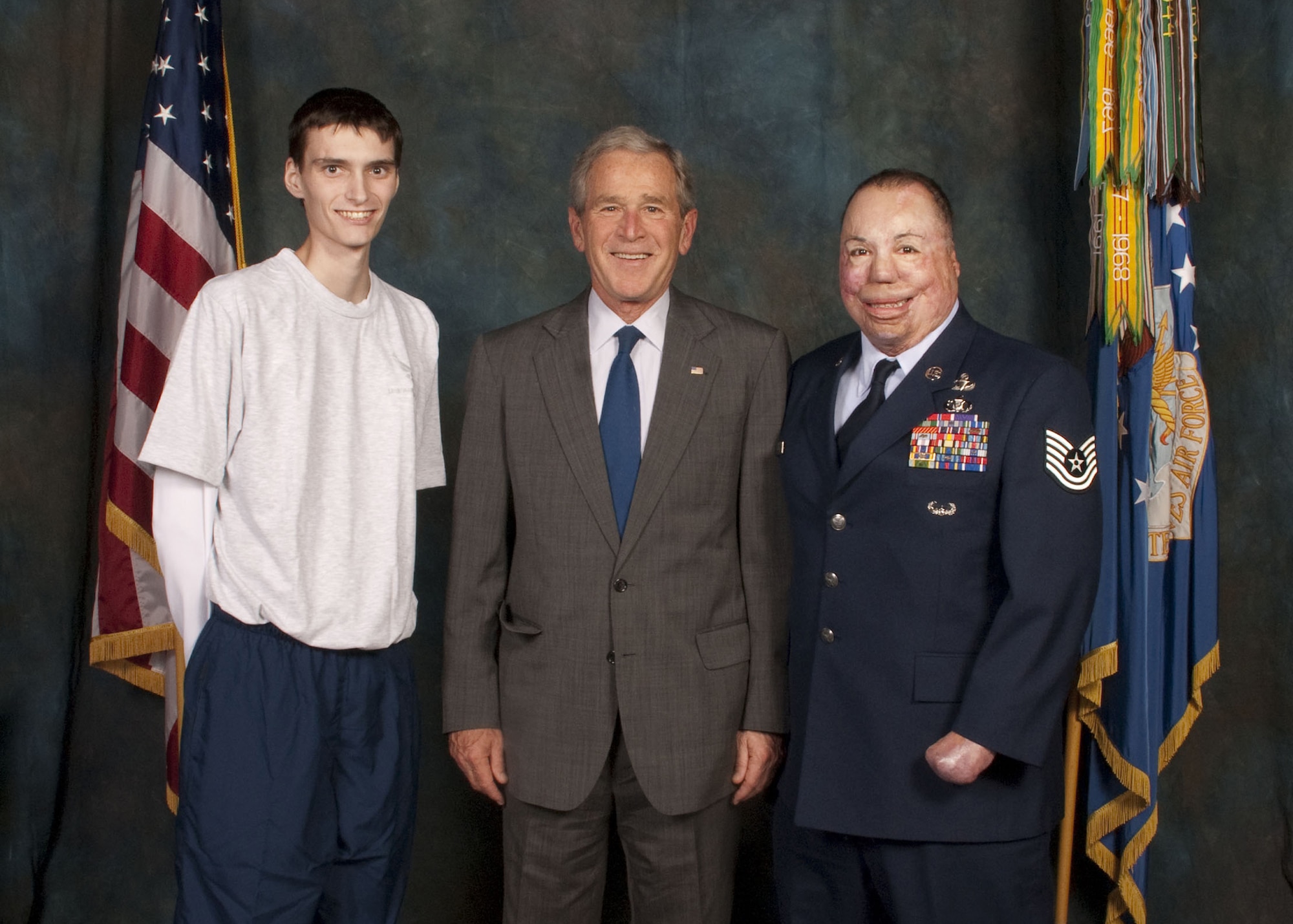 Air Force wounded warriors Senior Airman Tre Porfirio (left), from Wright-Patterson Air Force Base, Ohio, and Tech. Sgt. Israel Del Toro, from Lackland AFB, Texas, met with former President George W. Bush during a private reception following his Veterans Day speech Nov. 11, 2010, at the National Museum of the U.S. Air Force. (Courtesy photo)