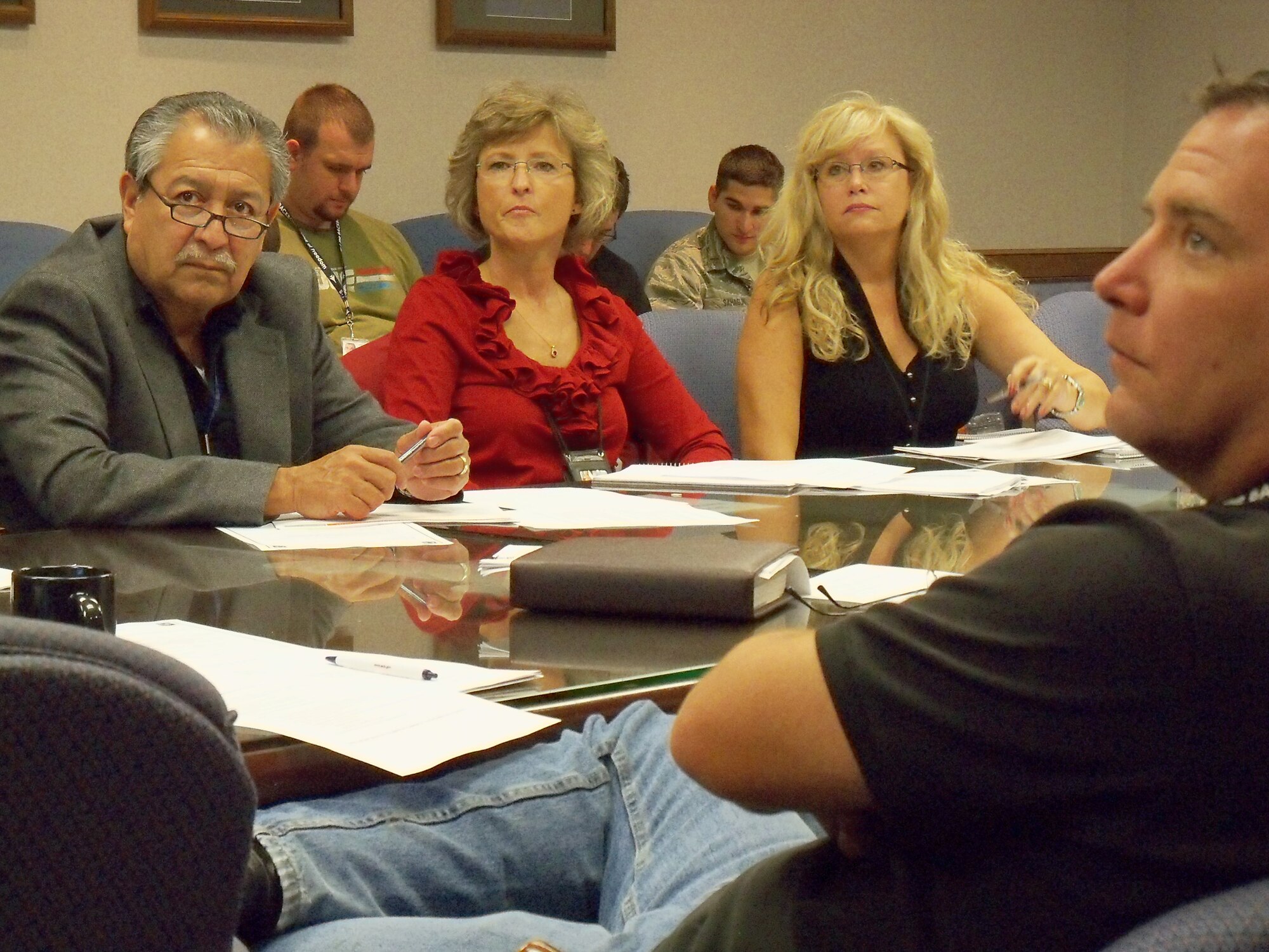 B-1 Division members Carlos Luna, Peggy Slavin, Debra Franklin and Michael Kreft, from left, listen as Gina Torrey, logistics management specialist with the Oklahoma City Air Logistics Center Aerospace Sustainment Directorate Weapon Supply Chain Management Office, briefs them on “Planning New Programmed Depot Maintenance Requirements Checklist” training. The purpose of training is to bring together the subject matter experts at the beginning of the requirement generation phase to strategically and collaboratively develop and document new tasks. (Air Force photo by Beverly Jones)
