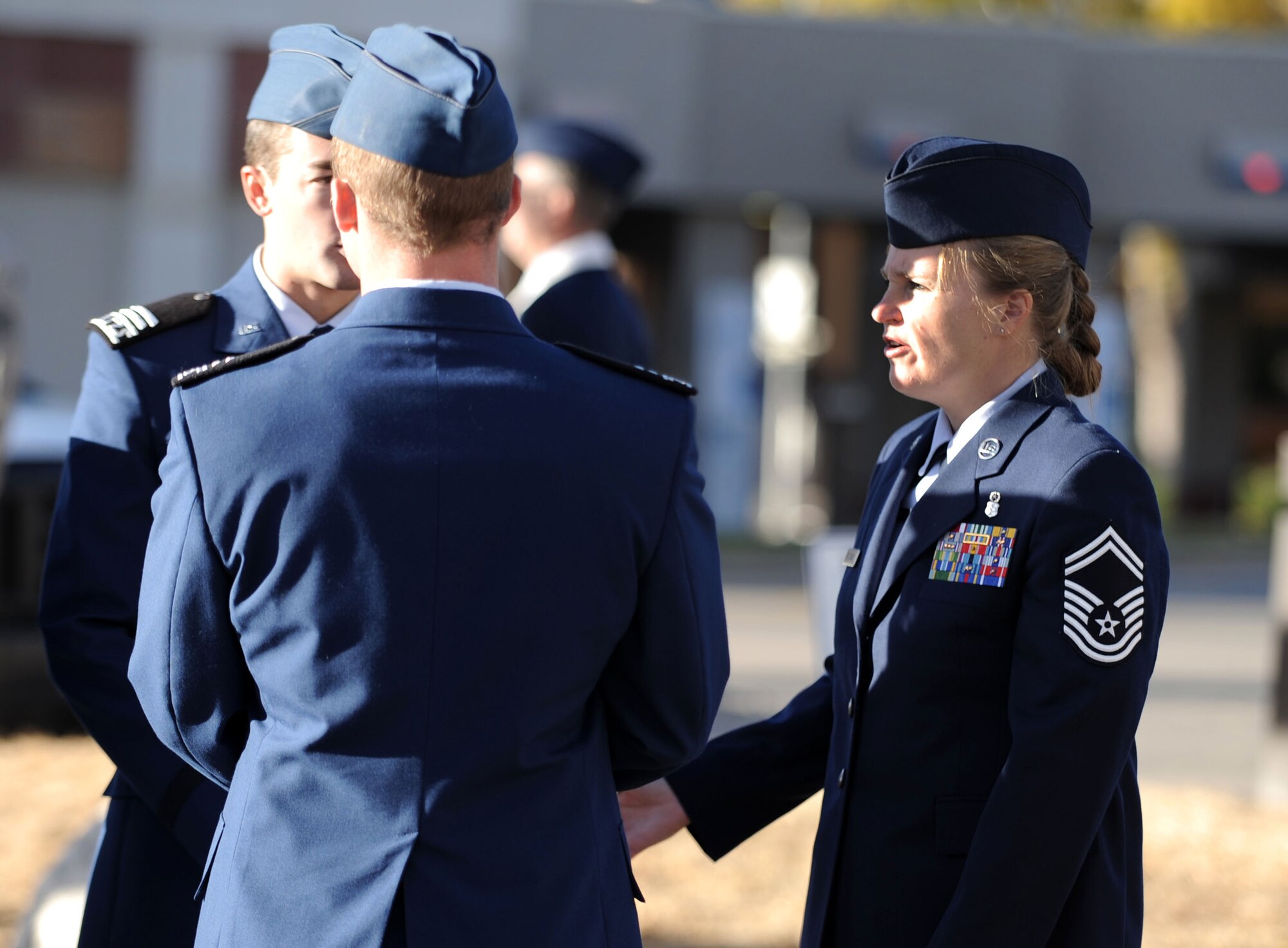 Senior Master Sgt. Megan St. Clair talks with Air Force Academy cadets during preparations for the Colorado Springs Veterans Day Parade Nov. 6, 2010. Sergeant St. Clair is a logistics technician with the 10th Medical Support Squadron at the Academy. (U.S. Air Force photo/Johnny Wilson)