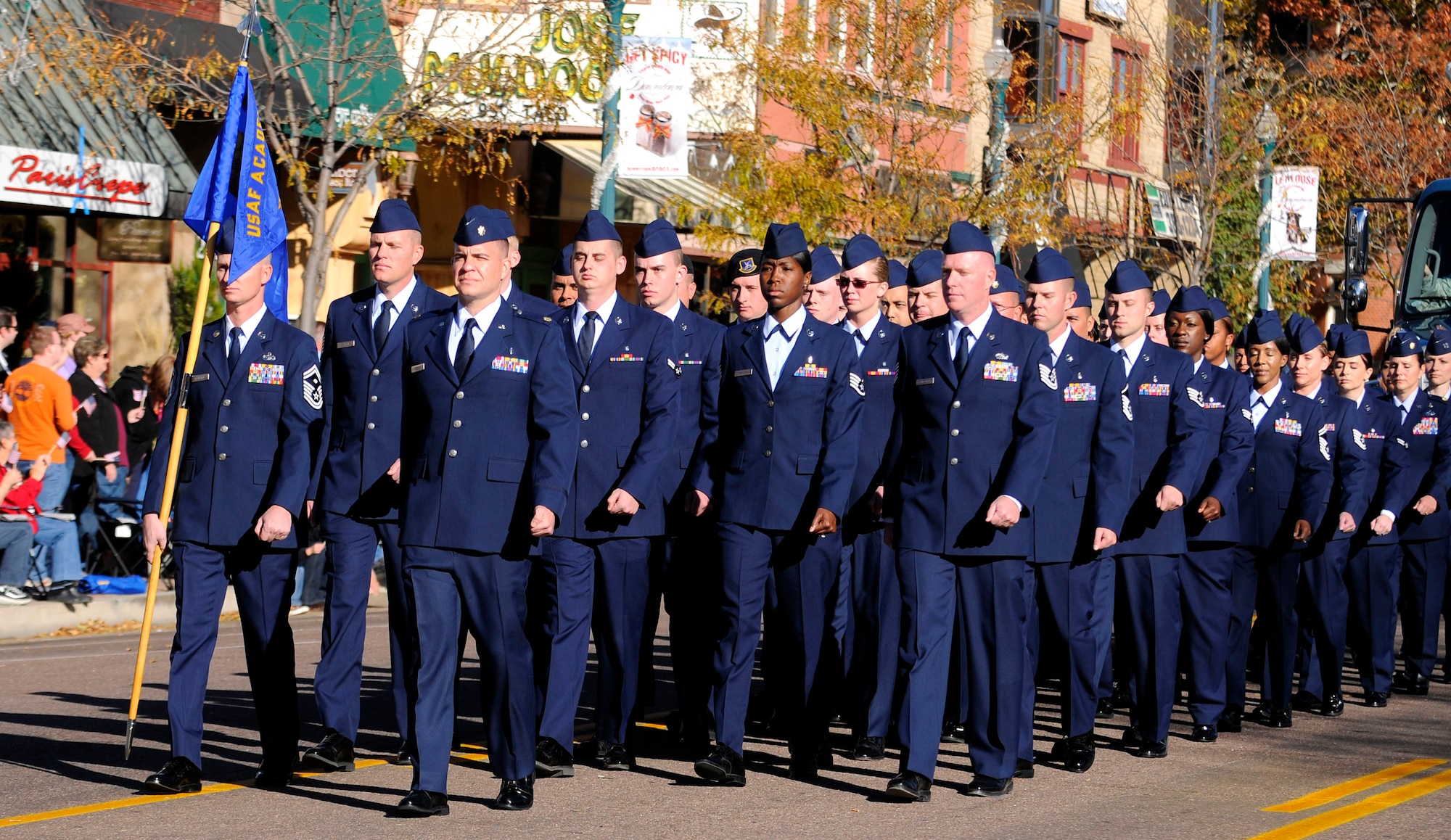 Airmen with the 10th Air Base Wing at the Air Force Academy march in formation during the Colorado Springs Veterans Day Parade Nov. 6, 2010. The Academy's presence in the parade also included a cadet formation, a float and the Air Force Academy Band. (U.S. Air Force photo/Johnny Wilson)