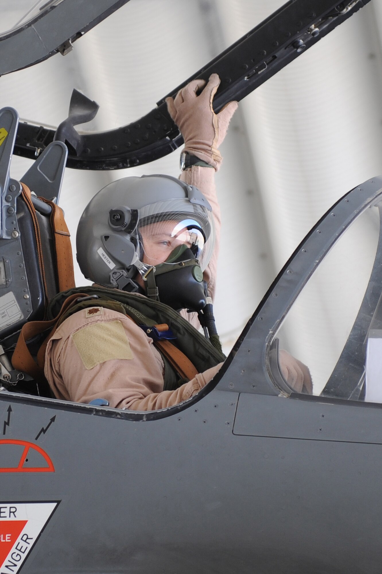 Major Skyler Hester closes the Mirage 2000D canopy before departing for a combat mission Nov. 11, 2010, at Kandahar Airfield, Afghanistan.  Major Hester from Kalaheo, Hawaii, is an instructor pilot assigned to the French 1/3 Fighter Squadron. He is deployed with the French unit as part of the three-year foreign exchange pilot program. (U.S. Air Force photo by Tech. Sgt. Chad Chisholm/Released)