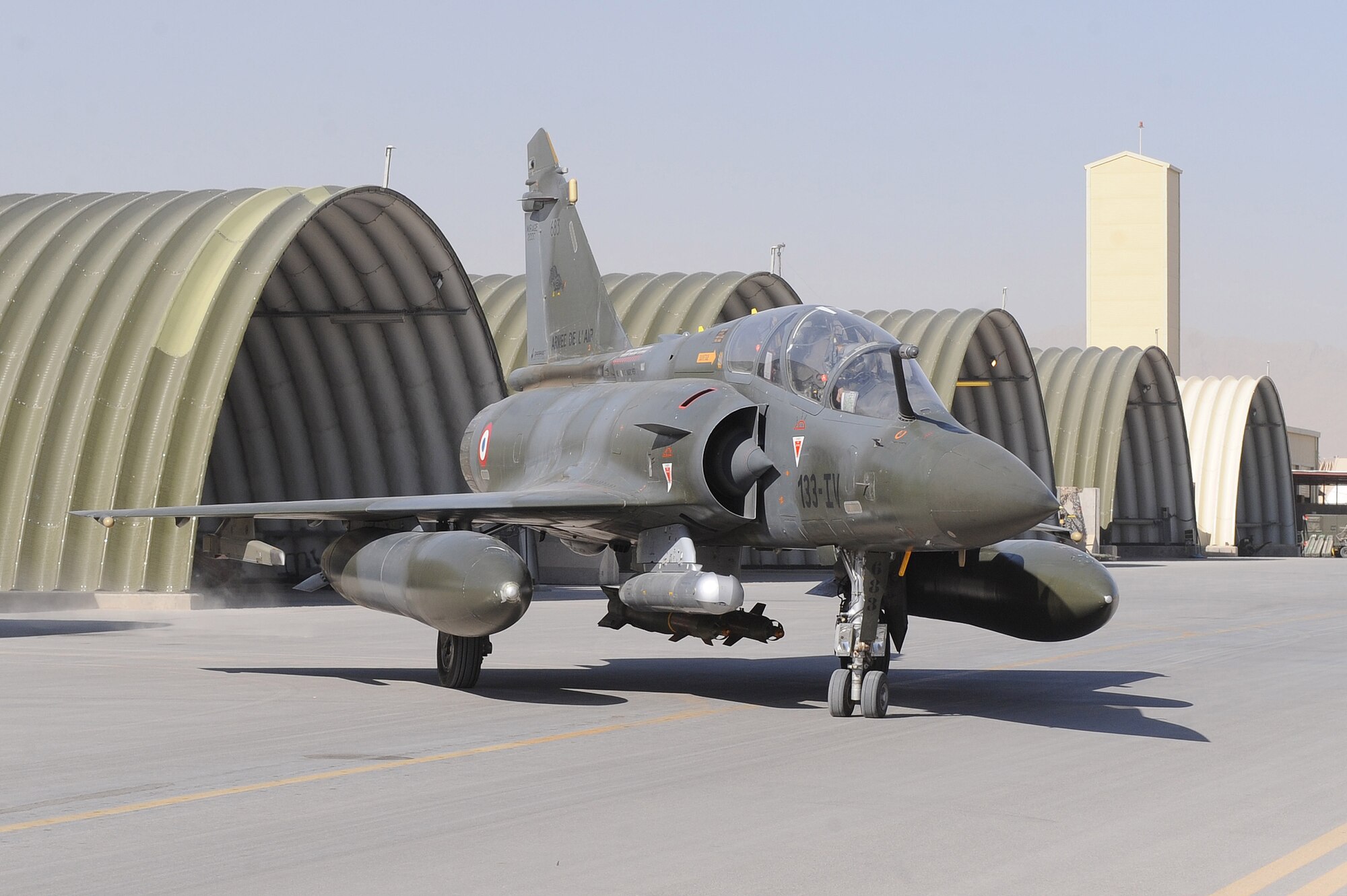 Maj. Skyler Hester and French Air Force Capt. Mathieu Boireau taxies from the aircraft shelter for a combat mission in a Mirage 2000D Nov. 11, 2010, at Kandahar Airfield, Afghanistan.  Major Hester from Kalaheo, Hawaii, is an instructor pilot assigned to the French 1/3 Fighter Squadron. He is deployed with the French unit as part of the three-year foreign exchange pilot program. (U.S. Air Force photo by Tech. Sgt. Chad Chisholm/Released)