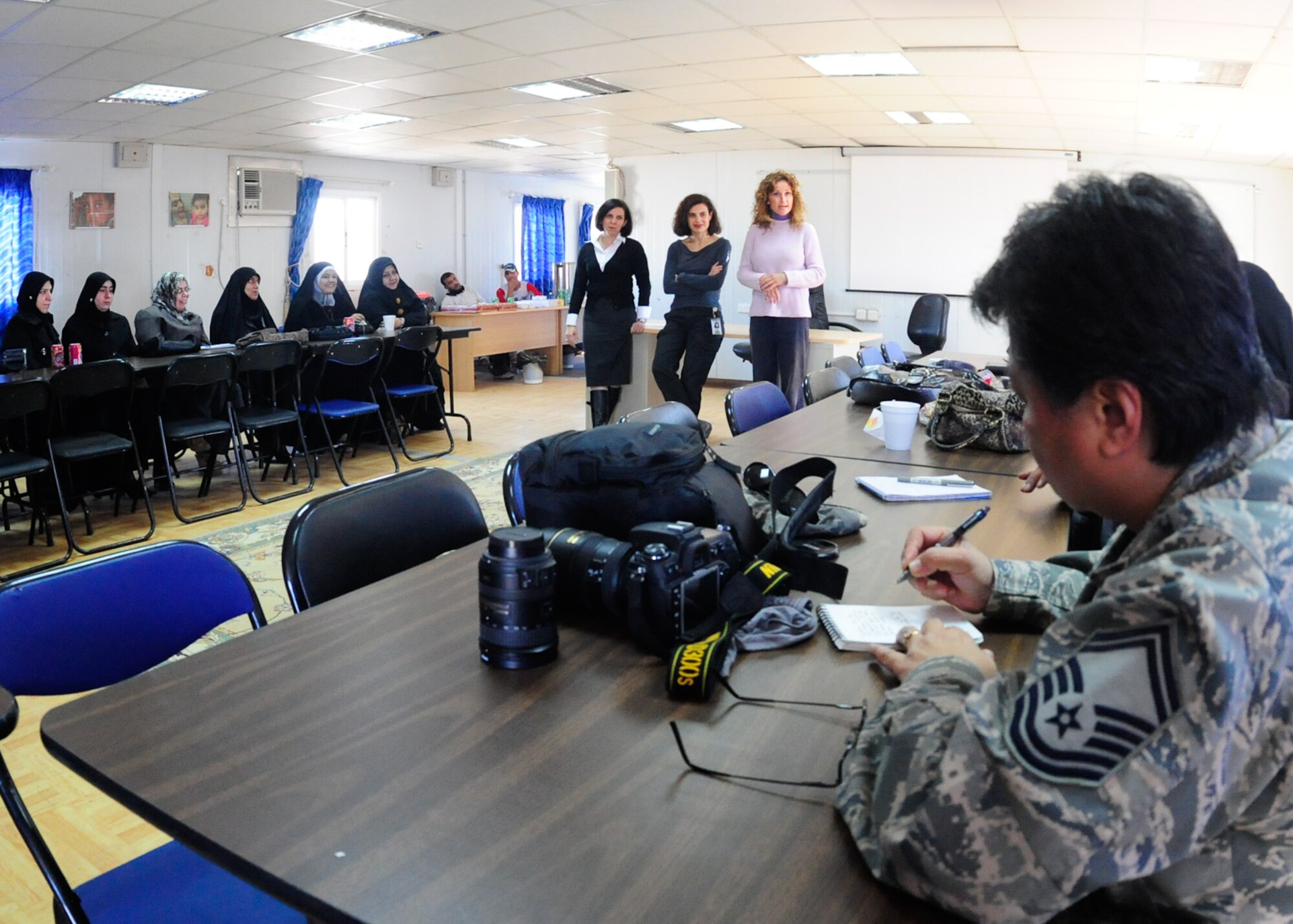 U.S. Air force Senior Master Sgt. Elizabeth Gilbert, 407th Air Expeditionary Wing, public affairs, participates in an all women journalist seminar held at the Itallian Proviscial Reconstruction Team camp to enhance the journalistic skills of Iraqi women prior to their national election Jan. 26, 2010. (U.S. Air Force photo by Master Sgt. Darrell Habisch/released)