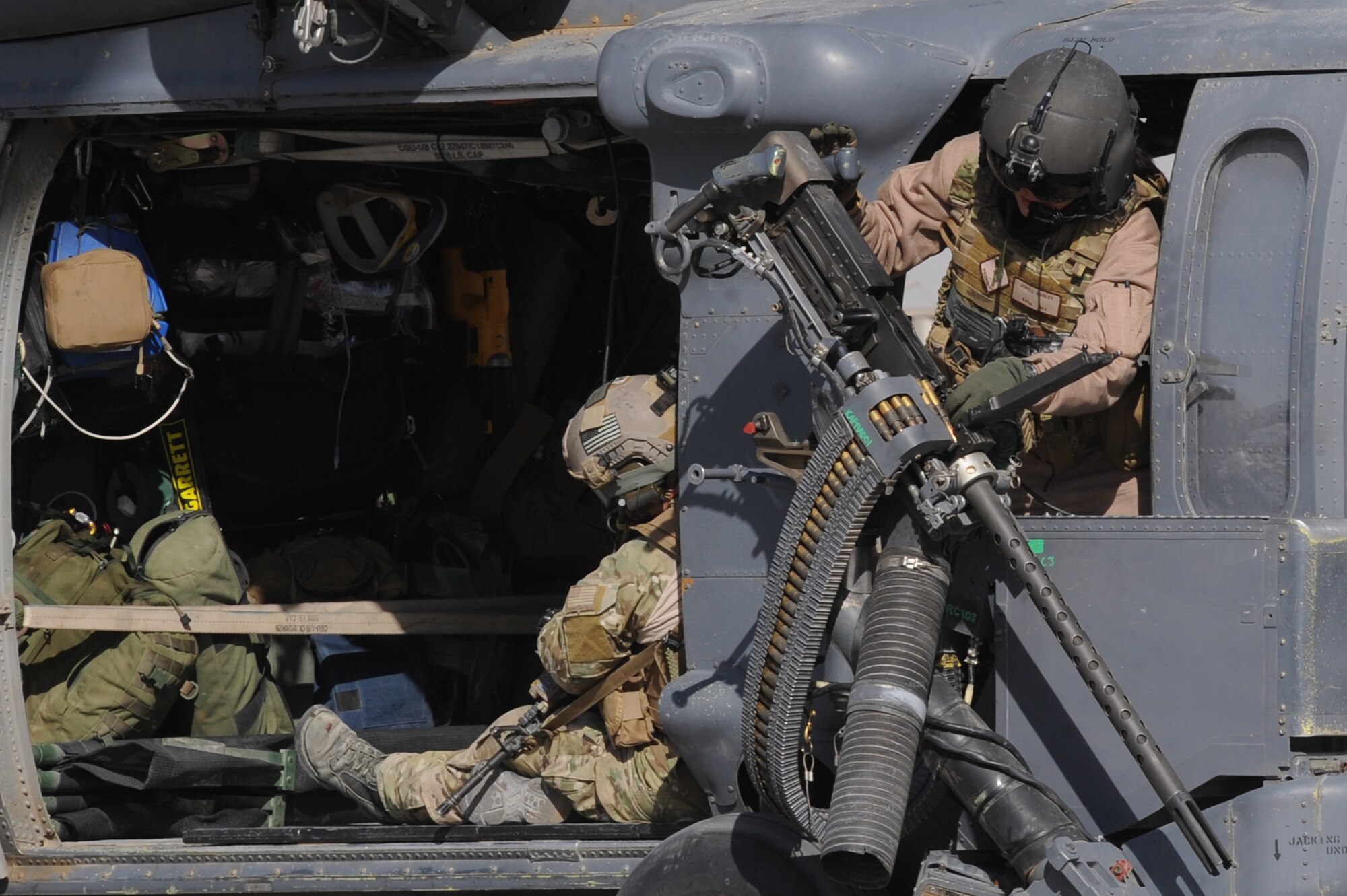 Staff Sgt. Jewell Shirley checks the operational readiness of a .50 caliber machine gun during an alert mission on an HH-60G Pave Hawk helicopter Nov. 6, 2010, at Camp Bastion, Afghanistan. Sergeant Shirley, from San Diego, is a flight engineer assigned to the 26th Expeditionary Rescue Squadron. (U.S. Air Force photo by Tech. Sgt. Chad Chisholm/Released)