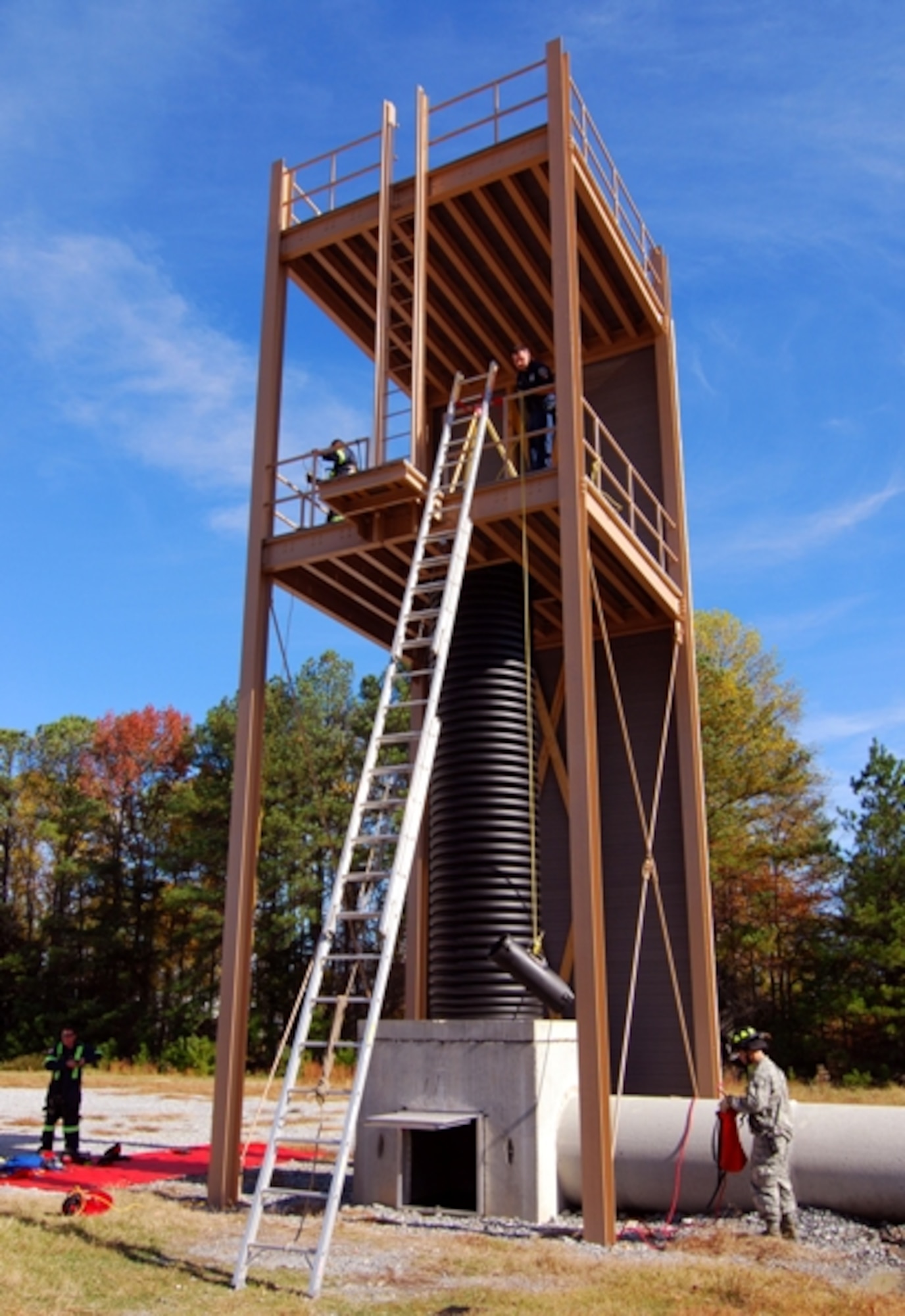 101110-F-0024F-055 – The Dobbins Air Reserve Base Fire Department uses the mid-level deck of this tower to simulate ground level in order to test their readiness and ability to find and extract an incapacitated worker from a confined space.  The tower provides an element of safety while affording the ability to train for underground scenarios.  (U.S. Air Force photo / Brad Fallin)
