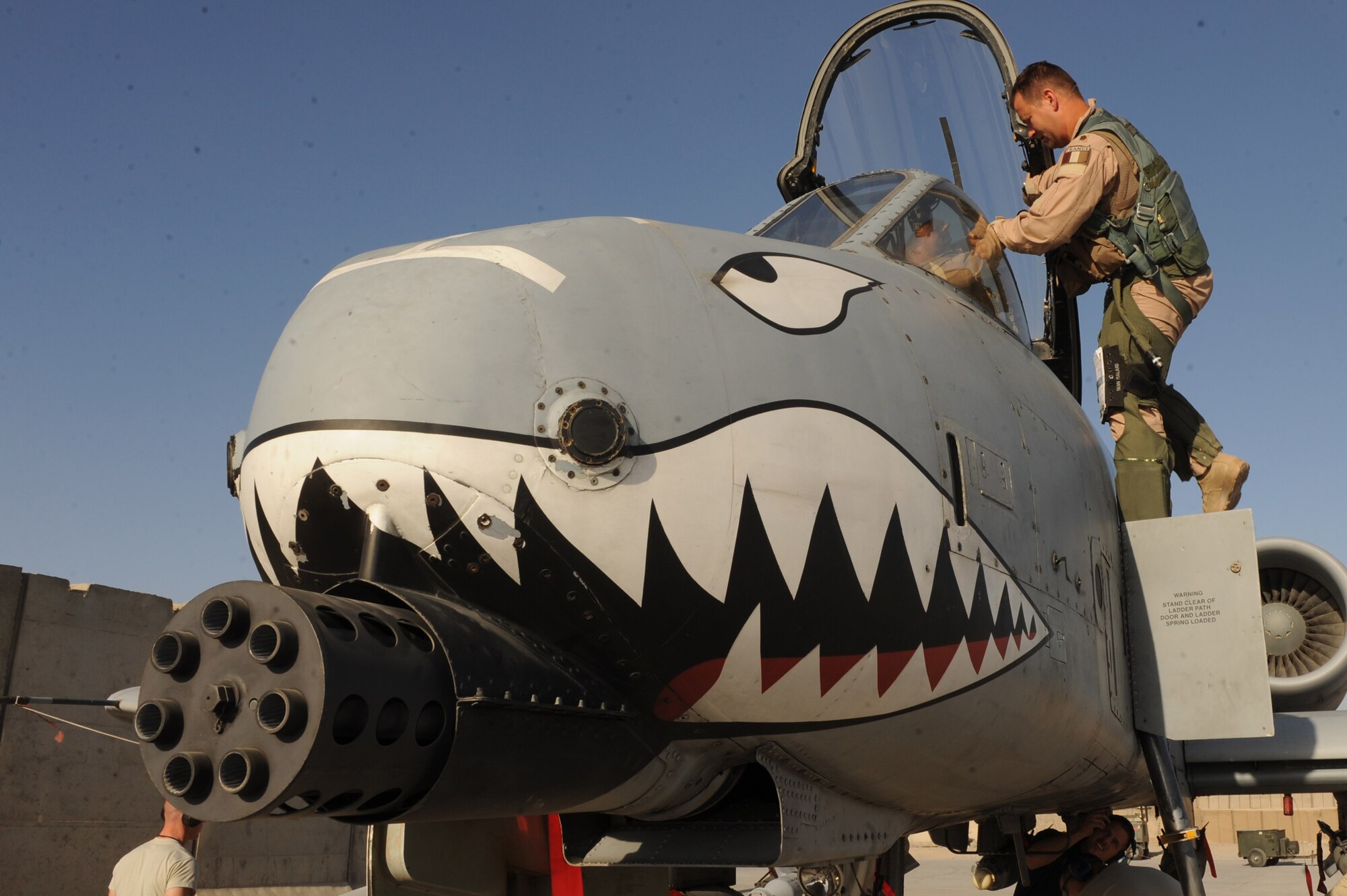 French Air Force Maj. Yann Malard exits an A-10C Thunderbolt II after a mission Nov. 10, 2010, at Kandahar Airfield, Afghanistan. Major Malard, from Nancy, France, is an assistant duty officer with the 75th Expeditionary Fighter Squadron. He is deployed with the American unit as part of the three-year foreign exchange pilot program. (U.S. Air Force photo by Tech. Sgt. Chad Chisholm/Released)