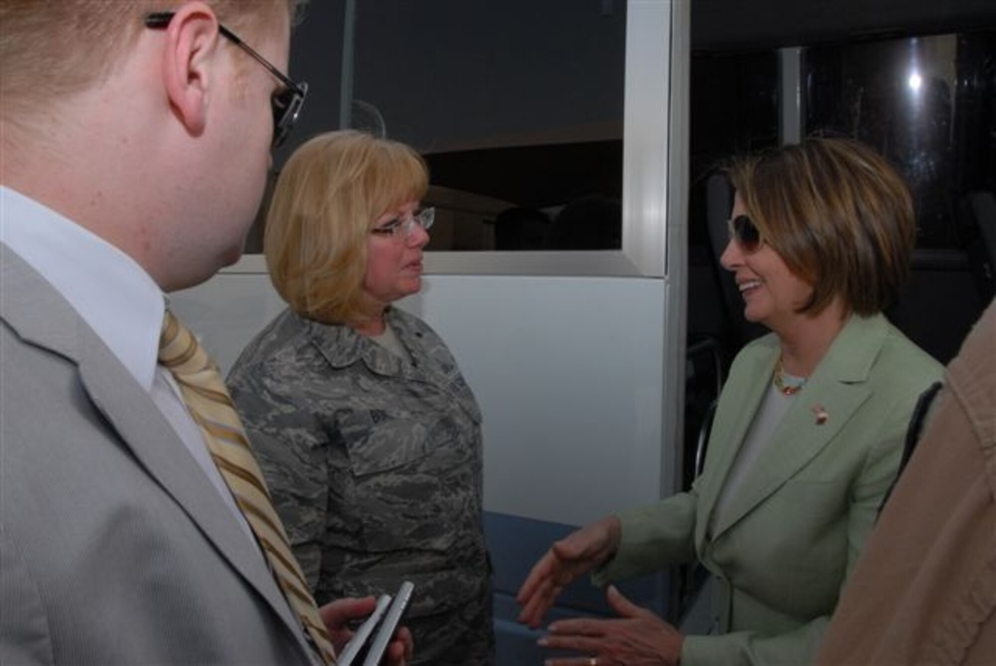 Carla Bove, 448th Supply Chain Management Wing chief of Protocol, left, meets with Nancy Pelosi, speaker of the United States House of Representatives, in Qatar before the women board a bus to visit another site on the compound. (Courtesy photo)