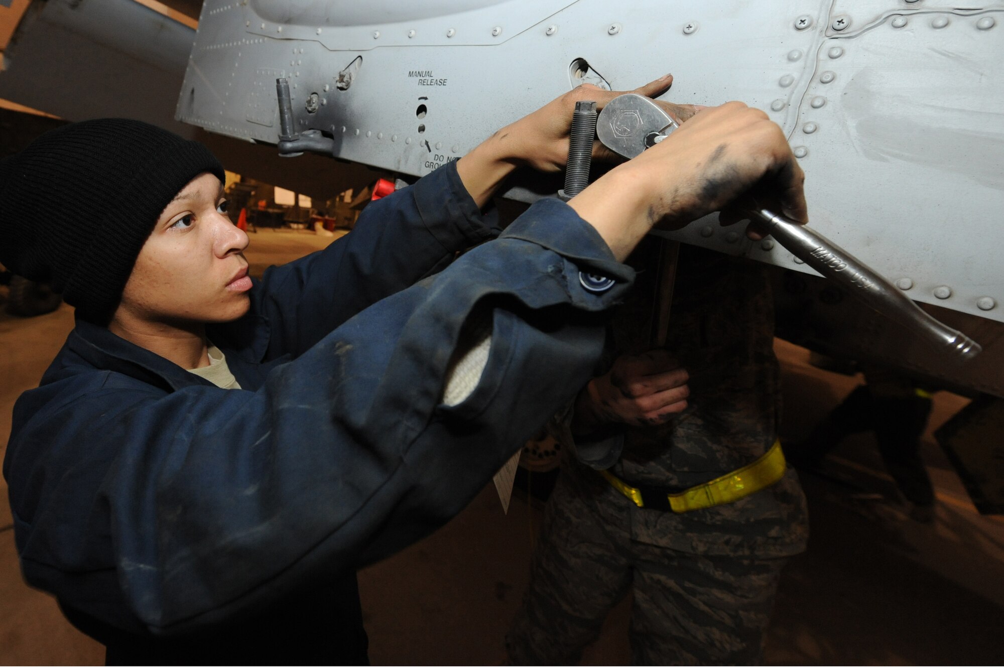 Senior Airman Athena Cole removes a bolt from the airframe of an A-10C Thunderbolt II during a phase inspection Nov. 10, 2010, at Kandahar Airfield, Afghanistan.  Airman Cole, from Benton Harbor, Mich., is an aircraft armament systems apprentice assigned to the 451th Expeditionary Maintenance Squadron A-10 Aircraft Maintenance Unit. (U.S. Air Force photo by Tech. Sgt. Chad Chisholm/Released) 