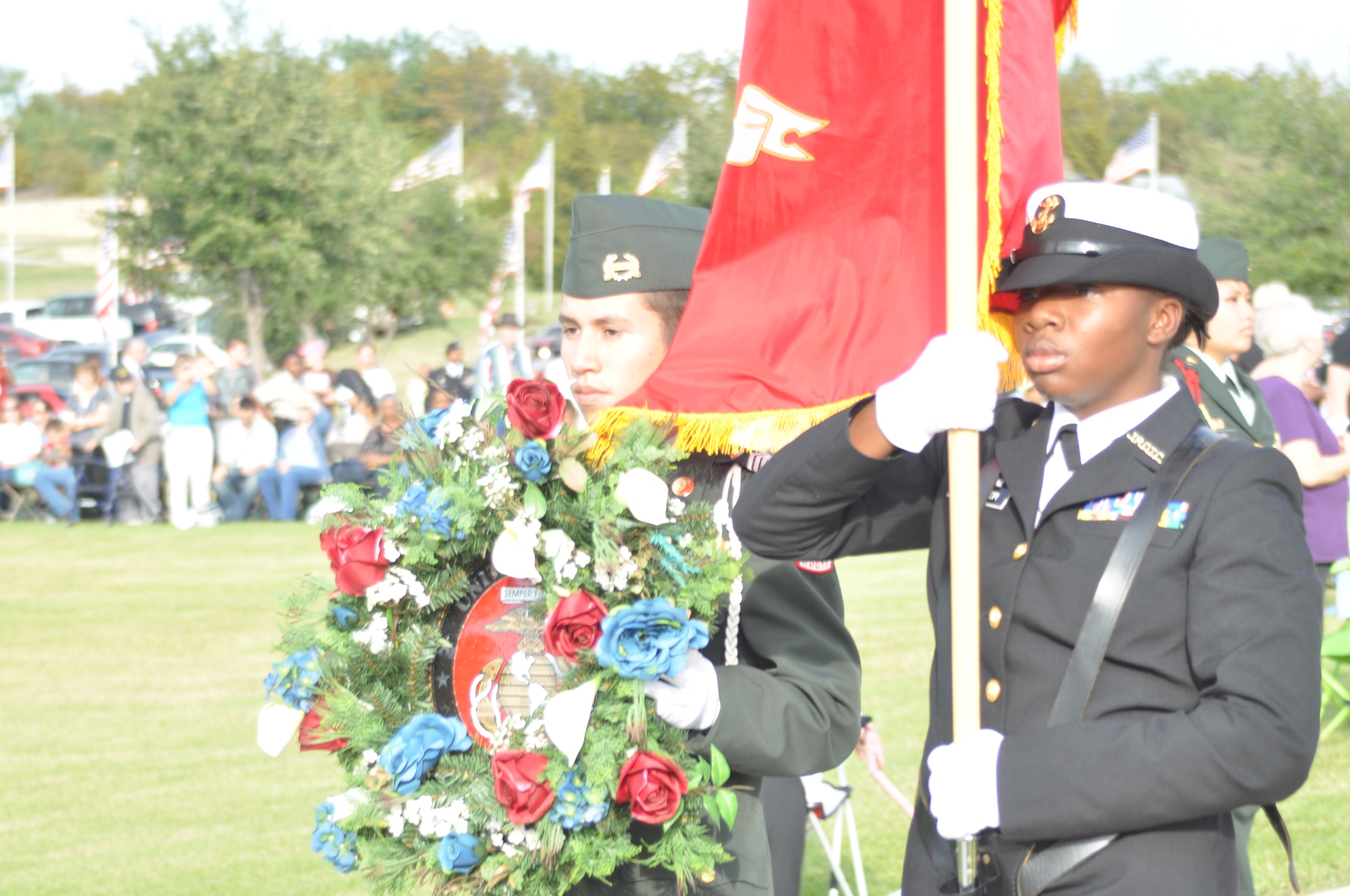 A wreath to honor the Marine Corp is presented by members of W.T. White High School's JROTC at a Veteran's Day ceremony Thursday, November 11 at Dallas-Fort Worth National Cemetery, Texas. Each branch of the military was presented with a wreath at the ceremony.