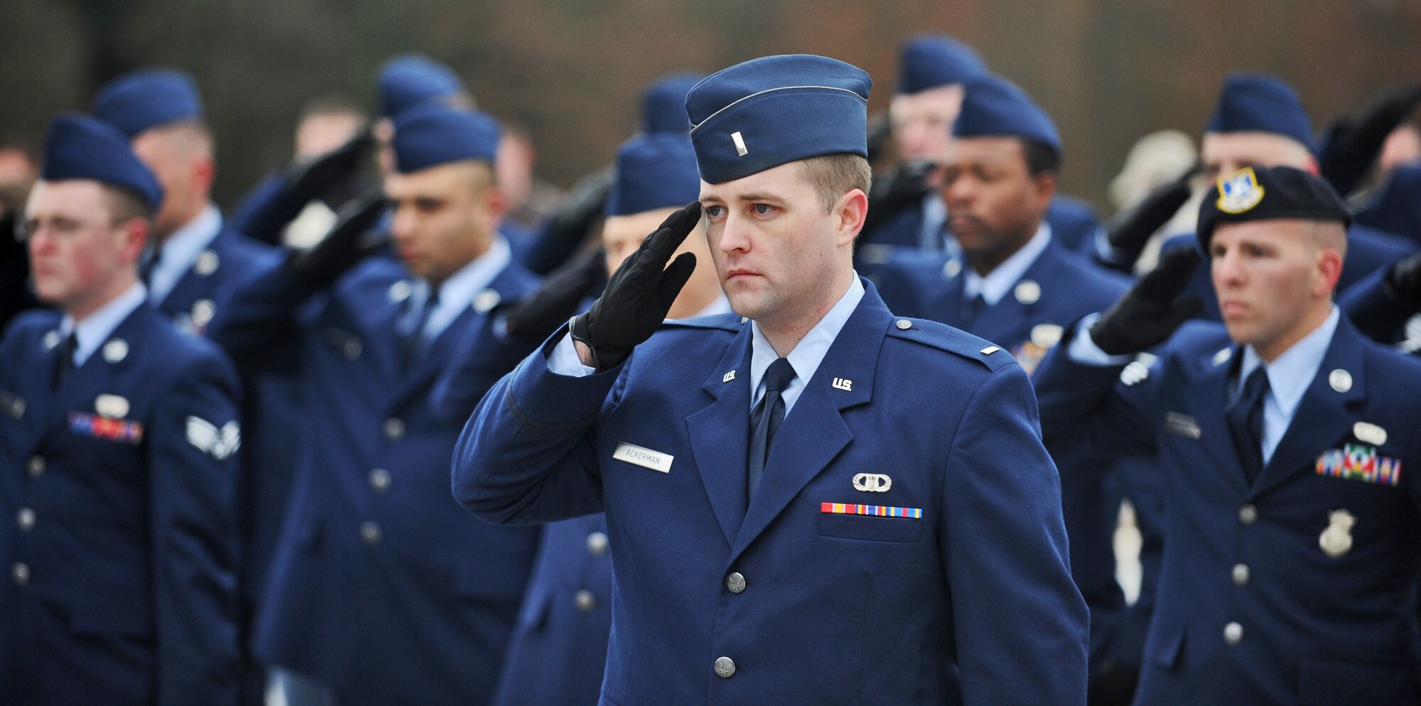 LUXEMBOURG – 1st Lt. Thomas Ackerman, 52nd Fighter Wing flight commander, salutes along with members of his flight during the Veteran’s Day ceremony at the Luxembourg American Cemetery and Memorial Nov. 11. More than 5,000 fallen servicemembers from World War II are buried at the 50.5 acre cemetery, which is one of 14 cemeteries established overseas after World War II.  (U.S. Air Force photo/Senior Airman Nick Wilson)