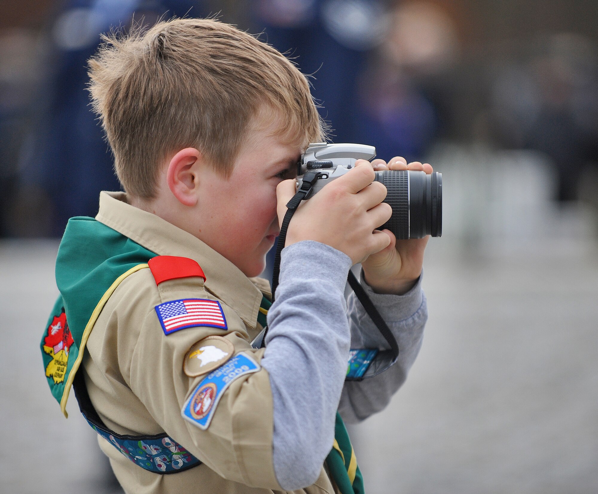 LUXEMBOURG – Adrean Chrostowski, 10,  Spangdahlem Air Base Boy Scout Troop 165 member, takes a photo during the Veteran’s Day ceremony at the Luxembourg American Cemetery and Memorial Nov. 11. More than 5,000 fallen servicemembers from World War II are buried at the 50.5 acre cemetery, which is one of 14 cemeteries established overseas after World War II. (U.S. Air Force photo/Senior Airman Nick Wilson)