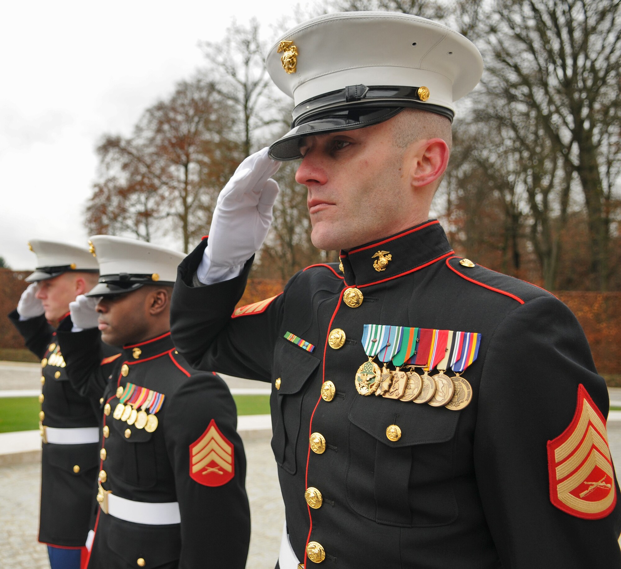 LUXEMBOURG – Marine Staff Sgt. Scott Pence, U.S. Embassy Marine detachment commander for marine security in Luxembourg, salutes during the Veteran’s Day ceremony at the Luxembourg American Cemetery and Memorial Nov. 11. More than 5,000 fallen servicemembers from World War II are buried at the 50.5 acre cemetery, which is one of 14 cemeteries established overseas after World War II.  (U.S. Air Force photo/Senior Airman Nick Wilson)