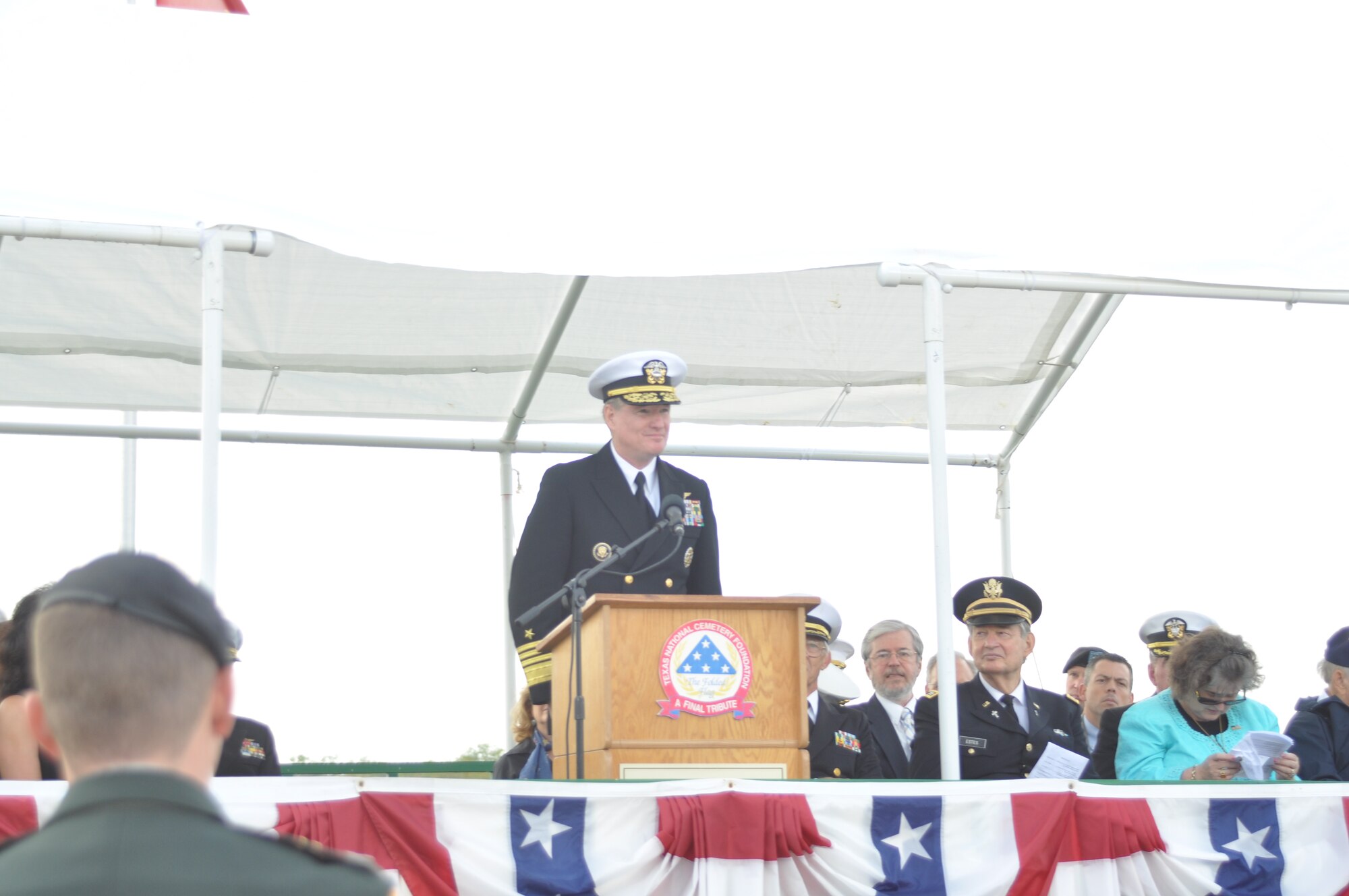 Admiral Patrick M. Walsh, commander of the U.S. Pacific Fleet, addresses attendees at a Veteran's Day ceremony Thursday, November 11 at Dallas-Fort Worth National Cemetery, Texas. Hundreds of people attended the ceremony to honor all veterans, past and present.