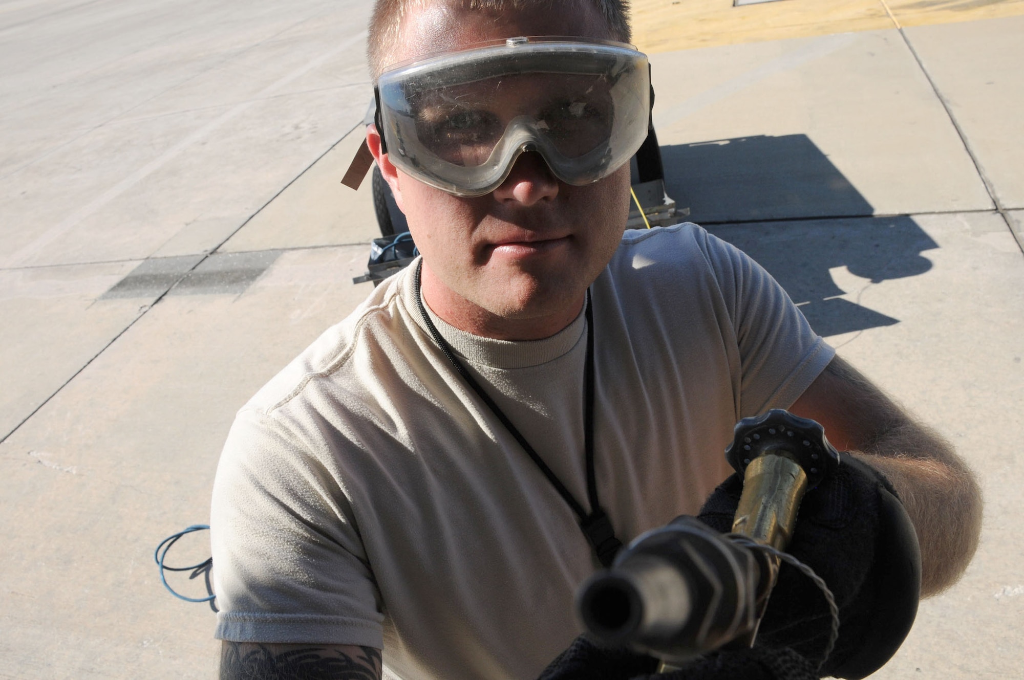 MacDill Air Force Base, Fla. --  Staff Sgt. Chris Sterling brings the gift of life, although he's not a doctor.  This crew chief with the 927th Air Refeuling Wing has the responsibility of making sure the oxygen tanks on the KC-135 tanker aircraft are at the right pressure.  If they are not, the pilots would not be able to breathe at 30,000 feet.  Sterling participated recently in an operational readiness exercise recently that tested the unit's ability to deploy their tanker aircraft on short notice. (Official United States Air Force photo by Staff Sgt. Shawn C. Rhodes)