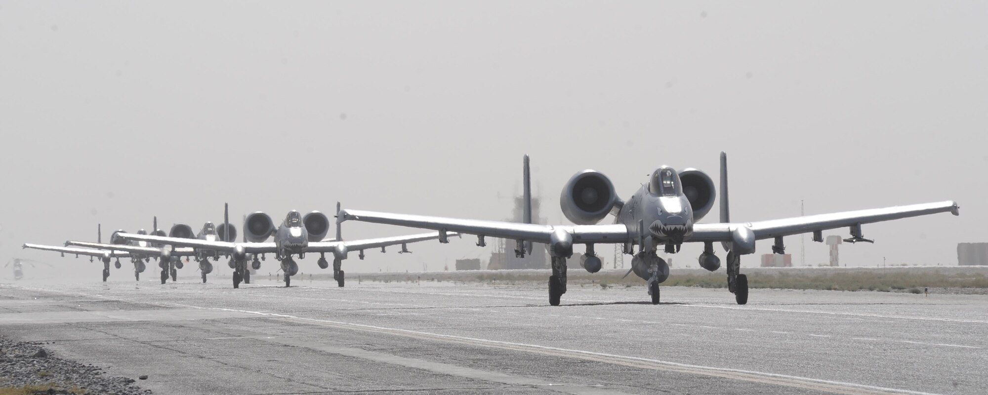A group of A-10C Thunderbolt IIs from the 75th Fighter Squadron line up on arrival at
Kandahar Air Field, Afghanistan, Sept.27. In the last few weeks, the 75th Expeditionary Fighter Squadron "Tiger Shark" aircraft have released more than 60,000 rounds of 30 mm ammunition during their many missions. (U.S. Air Force photo/Tech. Sgt. Chad Chisholm)(RELEASED)