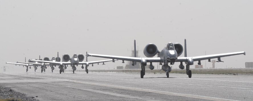 A group of A-10C Thunderbolt IIs from the 75th Fighter Squadron line up on arrival at
Kandahar Air Field, Afghanistan, Sept.27. In the last few weeks, the 75th Expeditionary Fighter Squadron "Tiger Shark" aircraft have released more than 60,000 rounds of 30 mm ammunition during their many missions. (U.S. Air Force photo/Tech. Sgt. Chad Chisholm)(RELEASED)