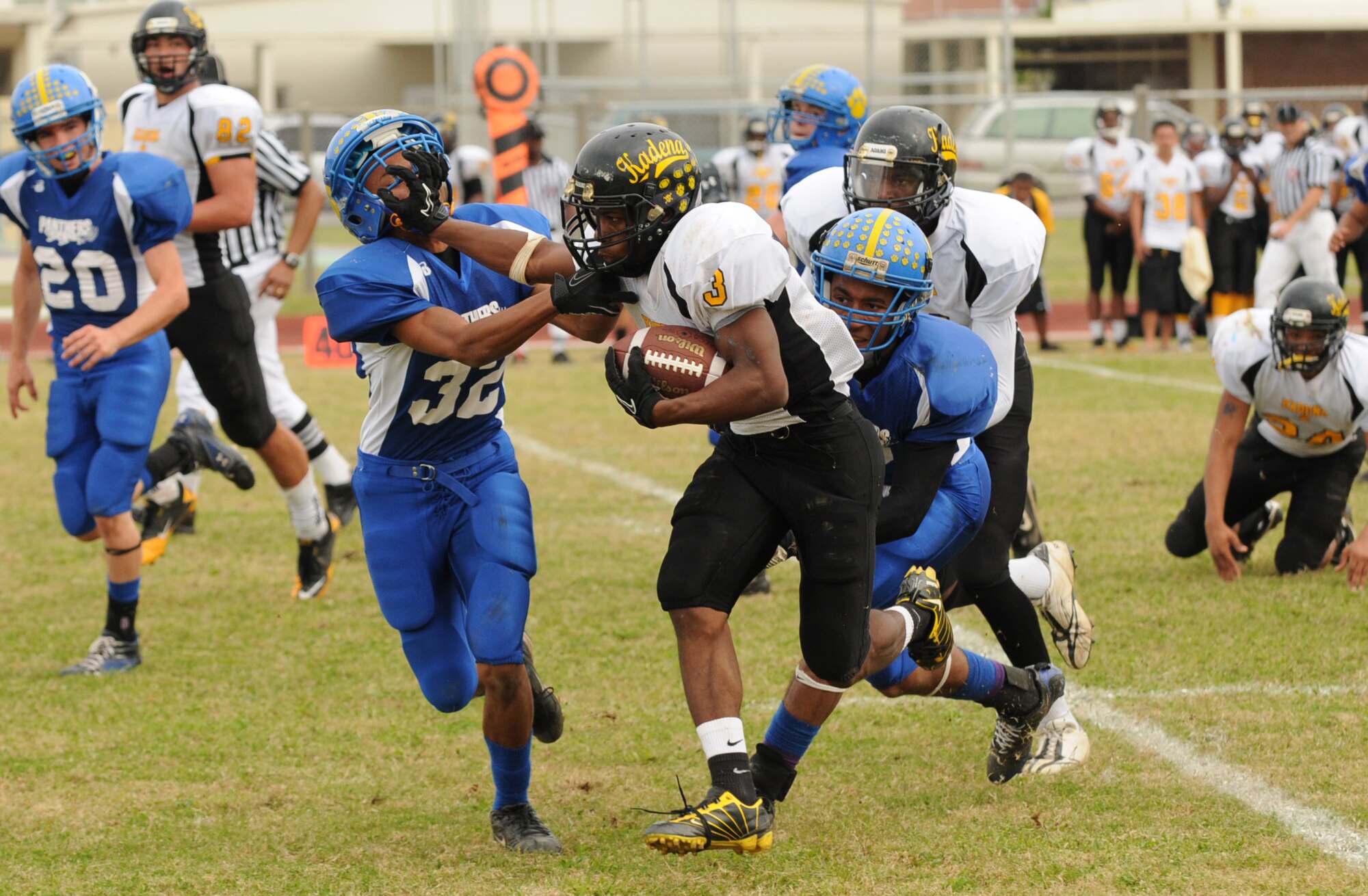 Kadena Panthers running back Shariff Coleman tries to break out into the open during the Pacific Far East football championship against Yokota High School Nov. 12. Coleman finished out his senior year with 110 total rushes for a Pacific-best 1,148 yards and 14 touchdowns. (Air Force/Tech. Sgt. Jason Lake)