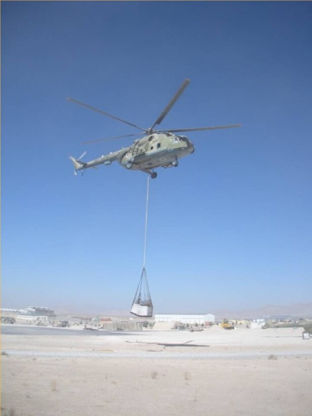 KANDAHAR, Afghanistan - Afghan Air Force Mi-17s can carry as much as 4,000 kilograms as well as bulky or oversized cargo externally using the sling load cargo delivery method.  While each sortie in Zabul averaged just 1,500 kilograms, they accomplished the mission safer and faster than internally loading the same cargo.  (U.S. Air Force photo/RELEASED).