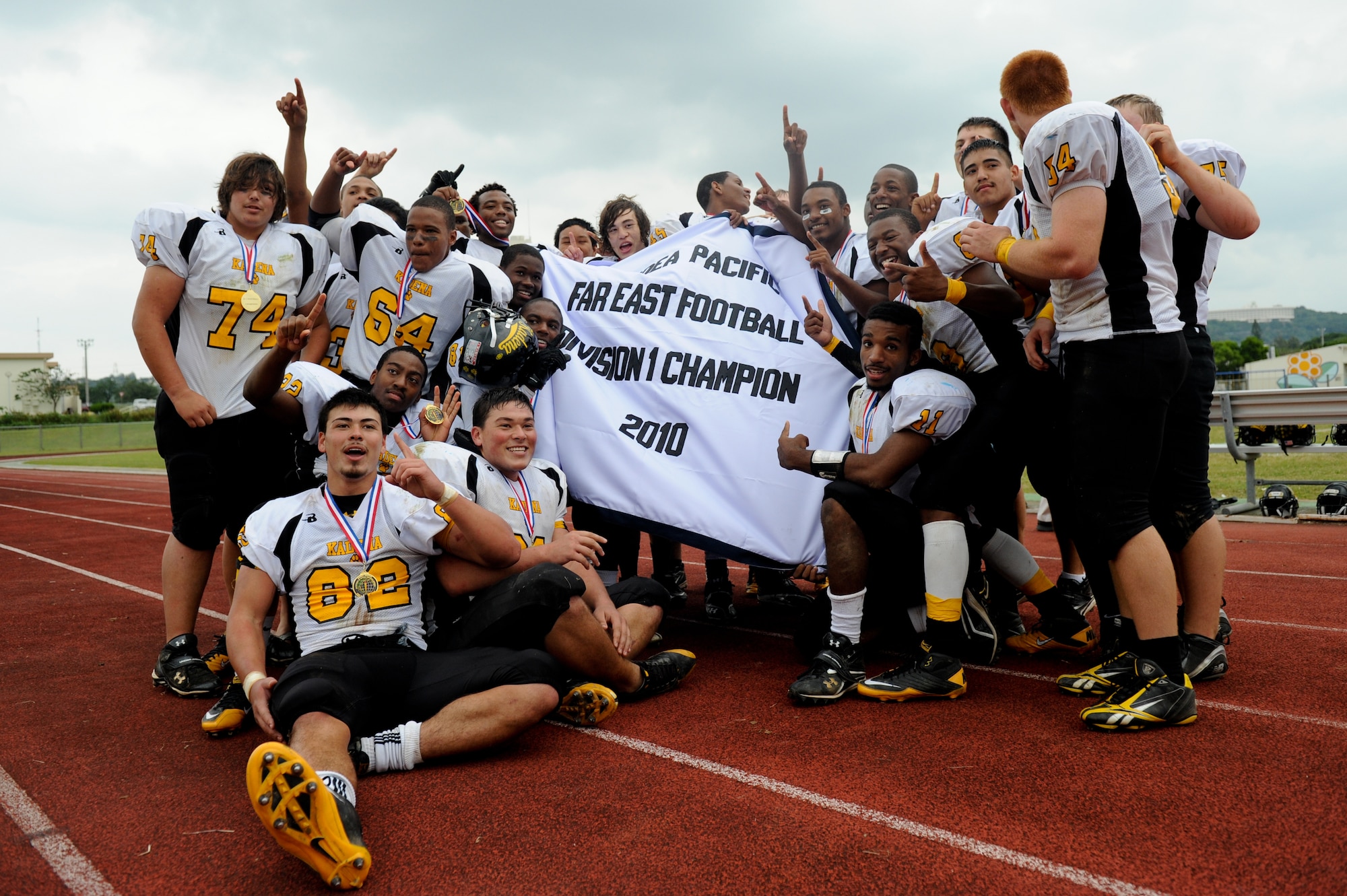 The Kadena Panthers hold their championship banner after beating the Yokota Panthers 50-23 in the DoDEA Pacific Far East Football Championships Nov 12. (U.S. Air Force photo/Staff Sgt. Jonathan Steffen