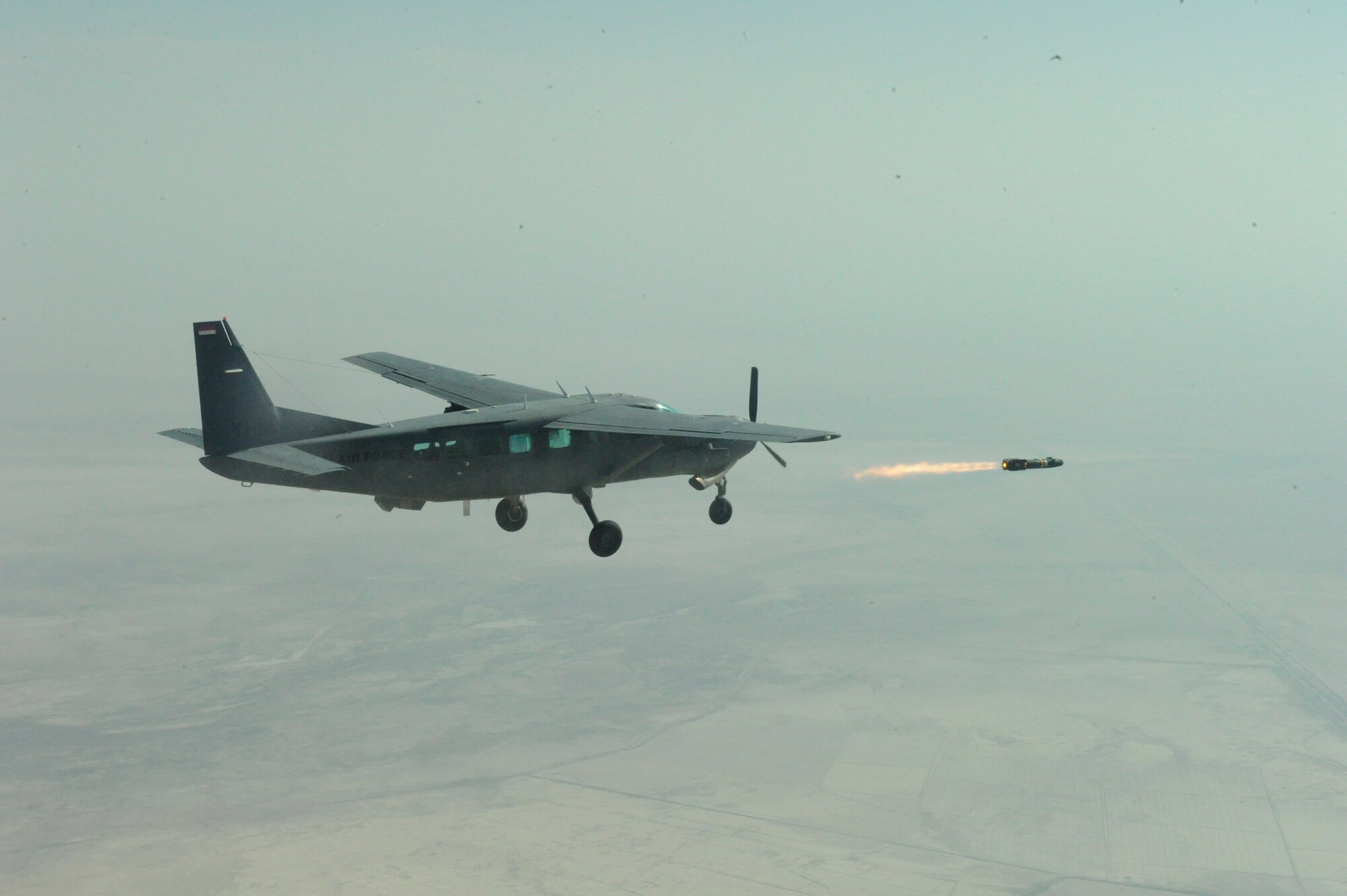 An Iraqi Air Force AC-208 Cessna Caravan aircrew launches a Hellfire missile at a target on the Aziziyah Training Range, south of Baghdad, Nov. 8. The Iraqi Airmen scored a direct hit, destroying the target in their second-ever launch of a Hellfire missile. Iraqi Airmen have trained continuously for the Hellfire mission, mastering the weapons load, target attack and airmanship skills necessary to maintain proficiency since completing their first Hellfire launch in 2009, also resulting in a direct hit of a training target. (U.S. Army photo by Sgt. Brandon Bolick / Released)