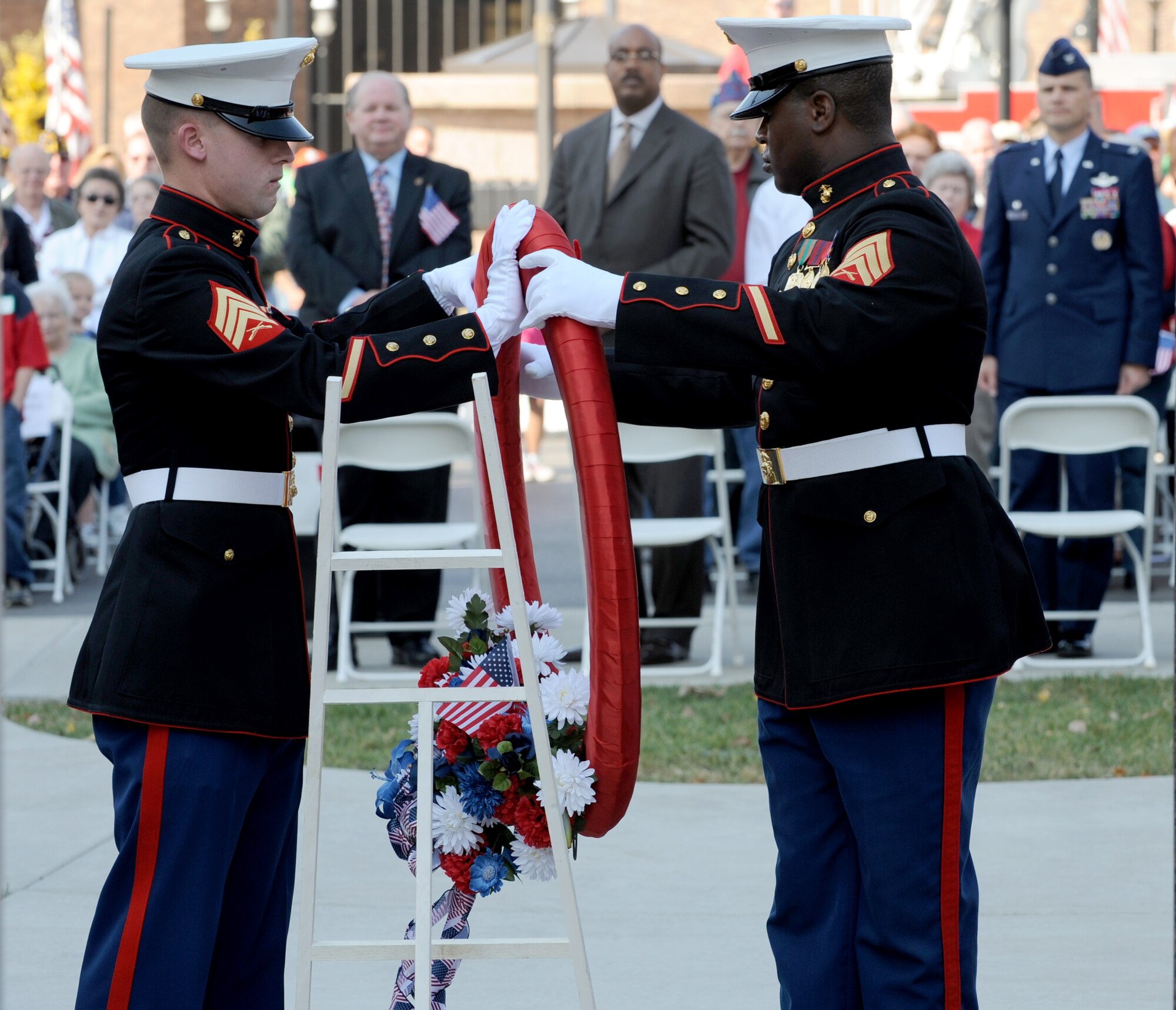 Two members of the United States Marine Corps place a wreath in the middle of the Veteran’s Memorial Monument in the center of Belleville, Ill. during a Veterans Day ceremony, Nov. 11, 2010. The ceremony was held to honor veterans both past and present and thank them for their service and sacrifice for their country. (U.S. Air Force photo by Staff Sgt. Brian J. Valencia)