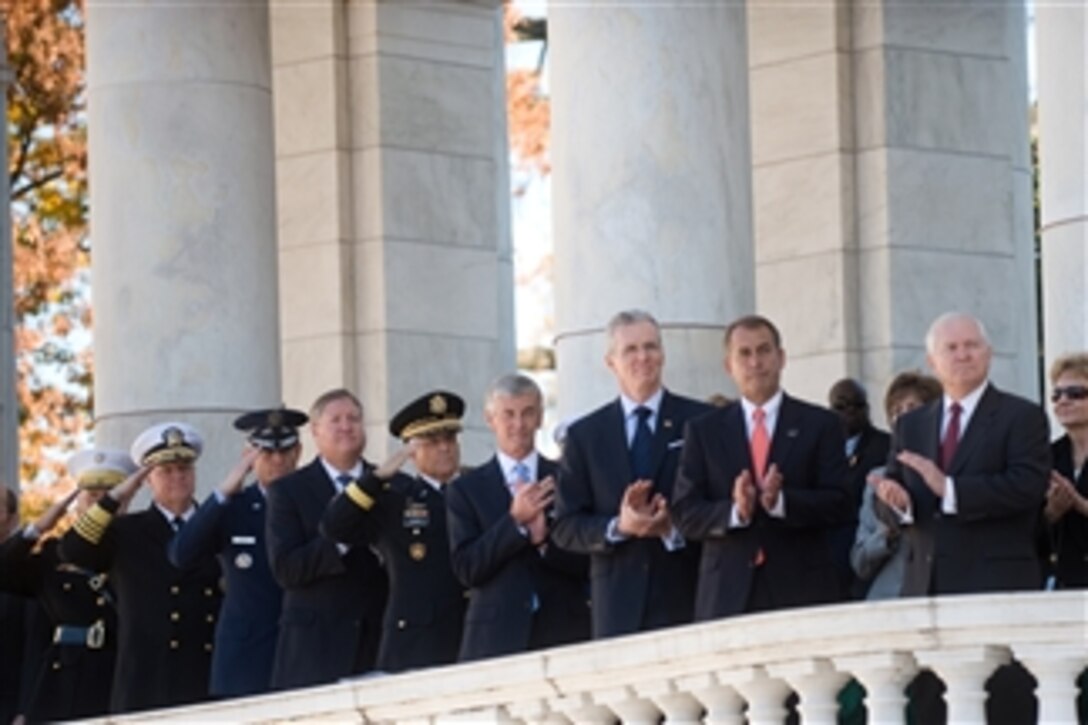 Rep. John A. Boehner (2nd from right), Secretary of Defense Robert M. Gates (right) and other Defense officials render honors during a Veteran's Day ceremony at Arlington National Cemetery on Nov. 11, 2010.  