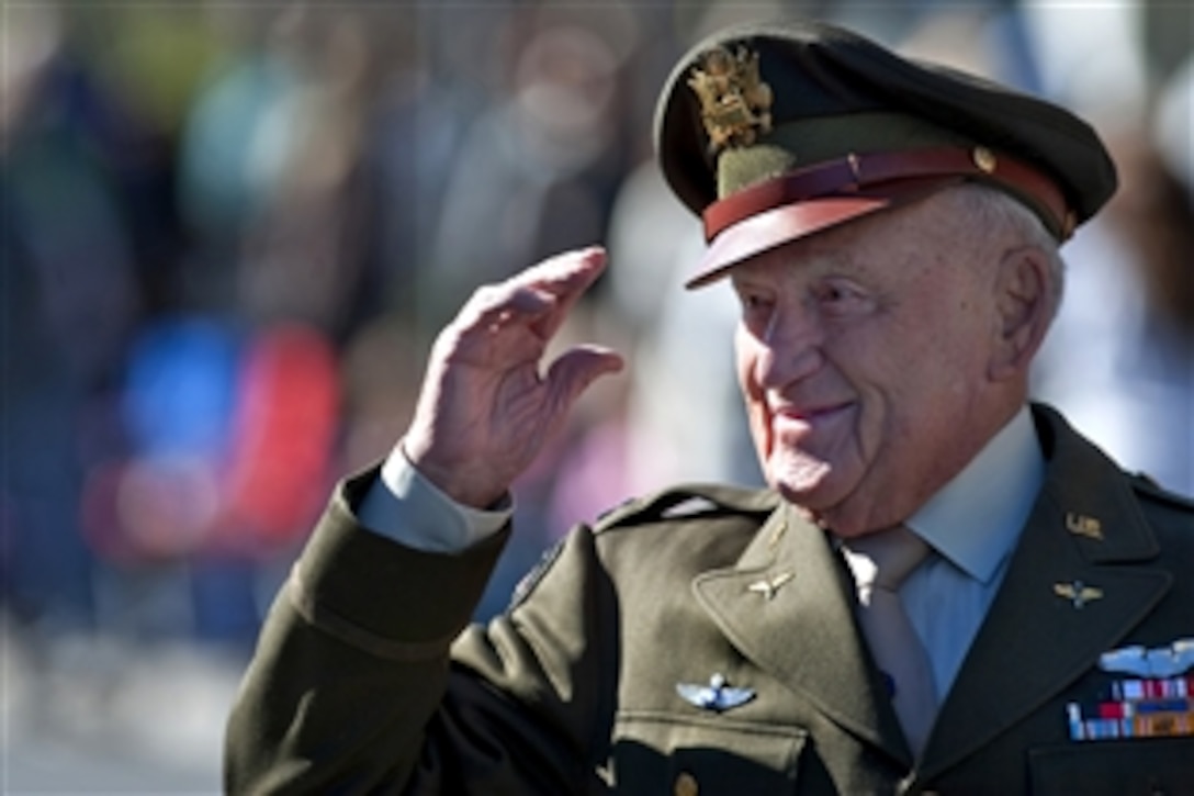 World War II fighter pilot and retired U.S. Army Air Forces Lt. Col. Jack Schofield salutes the crowd during the Las Vegas Veterans Day Parade in Las Vegas, Nev., Nov. 11, 2010. Schofield was a member of the fighter squadron known as the Flying Tigers.