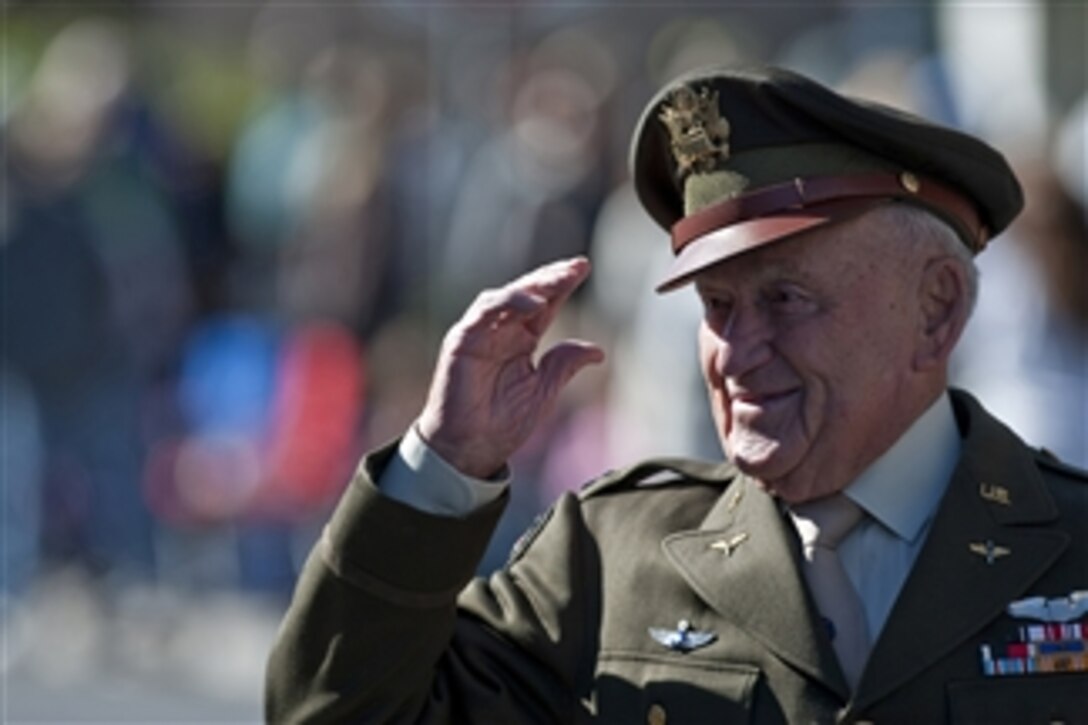 World War II fighter pilot and retired U.S. Army Air Forces Lt. Col. Jack Schofield salutes the crowd during the Las Vegas Veterans Day Parade in Las Vegas, Nev., on Nov. 11, 2010.  Schofield was a member of the fighter squadron known as the Flying Tigers.  