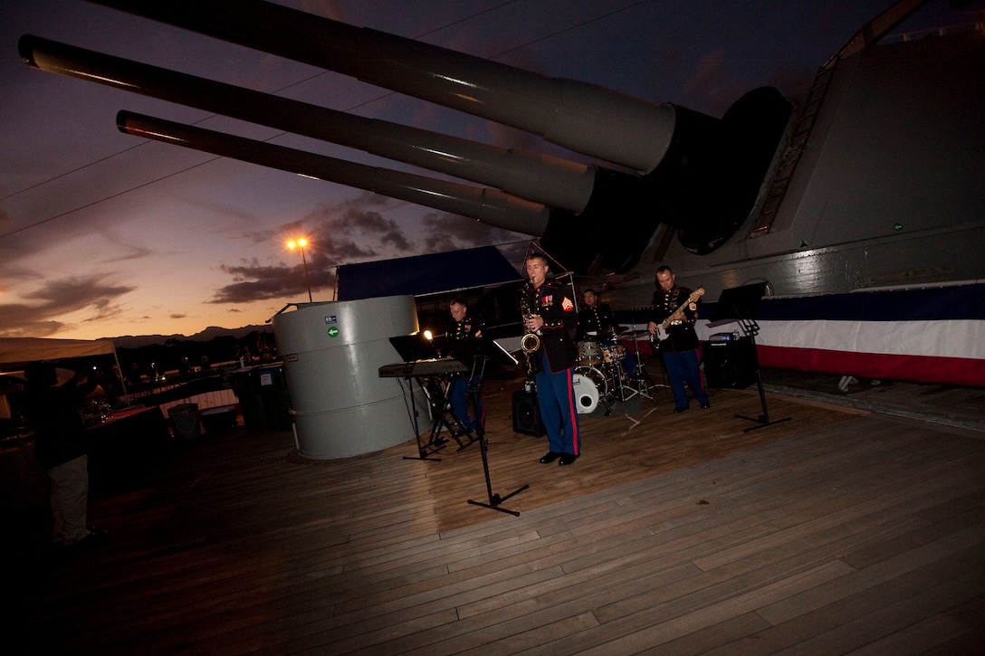 Musicians with the U.S. Marine Corps Forces, Pacific Band entertain guests during 3rd Marine Regiment’s birthday ball on the Battleship Missouri Memorial at Pearl Harbor, Hawaii, Nov. 12, 2010. The infantry regiment, one of the U.S. military’s most deployed units in recent conflicts, celebrated the Marine Corps’ 235th birthday aboard the storied battleship as a beautiful sunset fell beyond the harbor. On Sept. 2, 1945, the Empire of Japan surrendered to Allied forces on the deck of the historic “Mighty Mo” to end World War II.