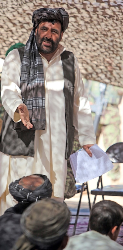 Alisha Khan Muslimyar, cultural chief of Helmand Province, speaks to a crowd of local elders during shura at Marine Corps Forward Operating Base Camp Hansen, Marjah, Afghanistan, Nov. 13, to denounce the Taliban’s use of Jihad as a justification for years of war and fighting in Afghanistan. Helmand Province government officials, along with local holy men, said the Taliban was using Jihad as a false pretext to fight foreign nations in Afghanistan.