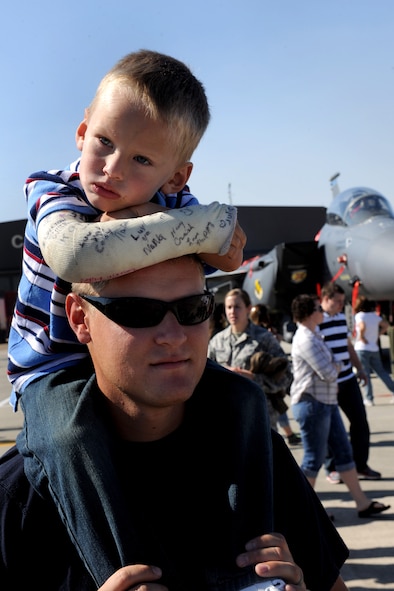MOODY AIR FORCE BASE, Ga. --Jacob Steinbach, son of Meghann and SSgt. Jason Steinbach, rests his head on his father’s shoulder after a long day at Moody’s Community Appreciation Day Air Show Nov. 13. Sergeant Steinbach said the air show was a great way to spend quality time with his family. (U.S. Air Force photo/Airman 1st Class Benjamin Wiseman)(RELEASED)