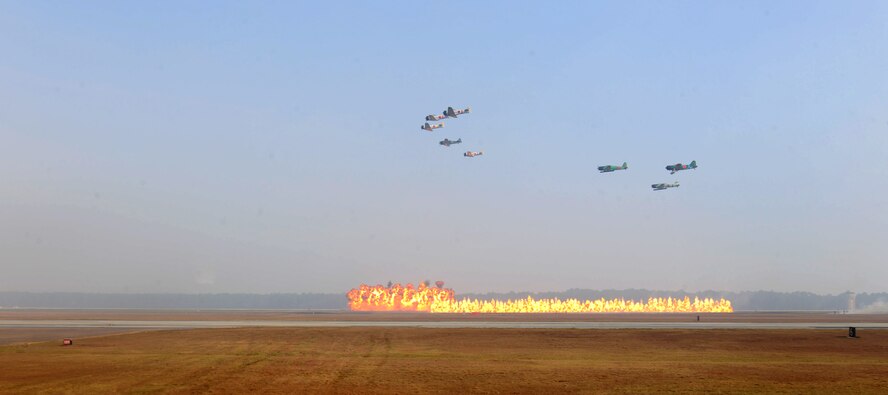 MOODY AIR FORCE BASE, Ga. --Tora, Tora, Tora, flight demonstration team, performs Aerial acrobats as incendiary devices are set off on the ground during Moody’s Community Appreciation Day Air Show Nov. 13. Tora, Tora, Tora reenacted the December 7th 1941 attack on Pearl Harbor during their demonstration. (U.S. Air Force photo/Airman 1st Class Benjamin Wiseman)(RELEASED)