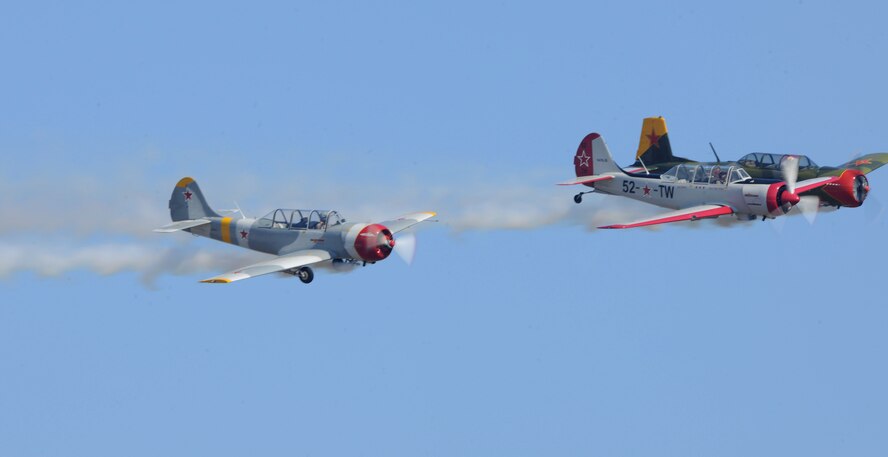 MOODY AIR FORCE BASE, Ga. --Three Aircrafts from the Red Thunder aerobatics team speed through the air as they perform daring aerial stunts during Moody’s Community Appreciation Day Air Show Nov. 13. The crowd cheered as the five-man crew performed several stunts to include barrel rolls and half Cuban eights.  (U.S. Air Force photo/Airman 1st Class Benjamin Wiseman)(RELEASED)